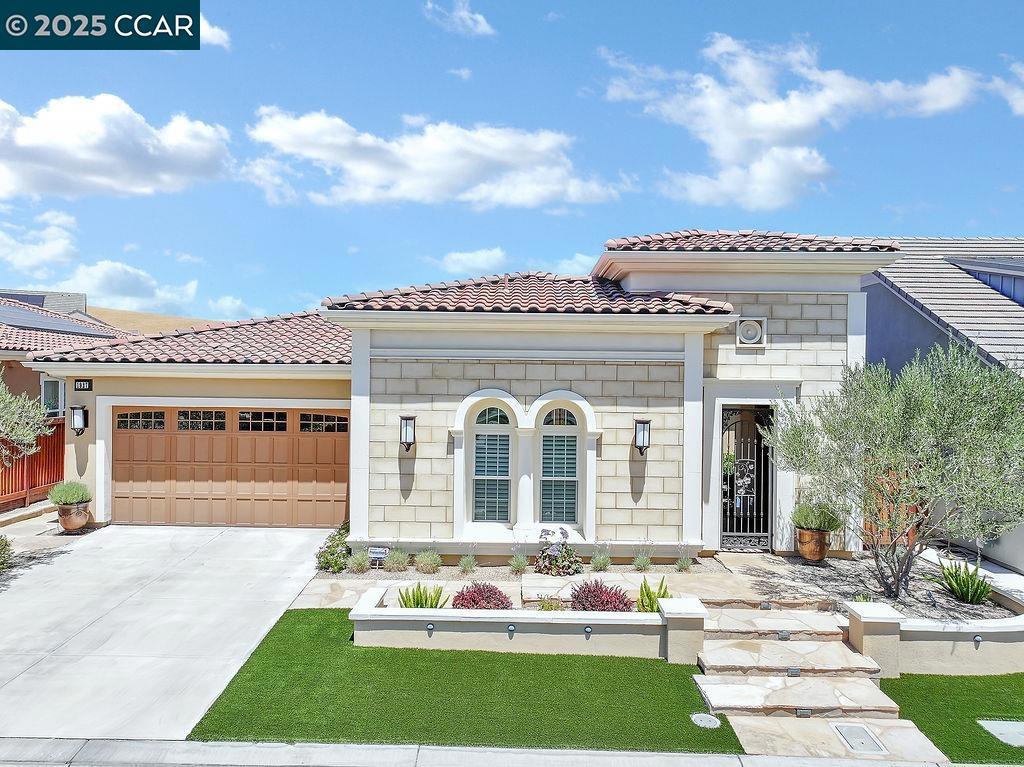 Stunning Italian Mistelle Model – $200K in Upgrades! Welcome to this exceptional 2-bed + office (or 3rd bed), 2.5-bath, 2,052 sq ft home in the 55+ Trilogy at the Vineyards by Shea Homes in Brentwood. Boasting a striking Italian elevation, enjoy a private gated entry, lush landscaping, and flagstone walkway. The tandem 3-car garage features epoxy floors and a builder-paid solar lease. Inside, you will find engineered hardwood flooring, upgraded carpet, designer lighting, plantation shutters, and custom window treatments. The gourmet kitchen is a chef’s dream with granite counters, custom cabinetry, backsplash, wine fridge, gas stove, top-tier appliances, and two walk-in pantries. The primary suite offers dual walk-in closets, separate vanities, marble flooring, and a luxurious shower. The guest suite with private bath is ideally separated for privacy. Enjoy a formal dining room, spacious great room, and a fully equipped laundry room with washer & dryer. The resort-style backyard stuns with a solar-heated pool, extended covered patio, outdoor kitchen with built-in BBQ, firepit, and low-maintenance landscaping. Residents enjoy world-class amenities: The Club with spa, gym, pools, tennis, pickleball, bocce & endless social activities. This is luxury retirement living at its finest!