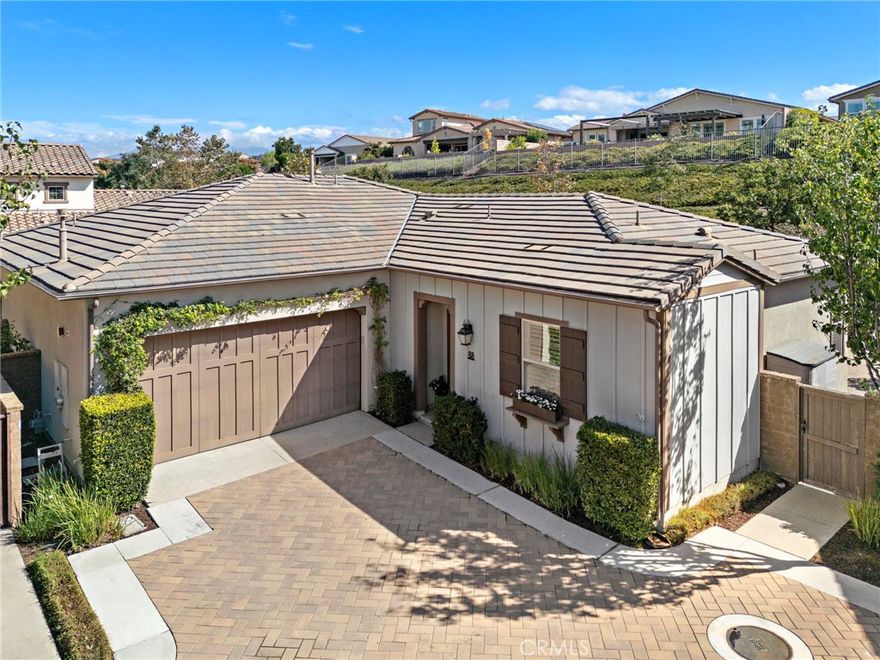 Welcome to this beautifully upgraded single-story home, in the coveted 55+ enclave of Avocet, ideally situated on an oversized, private lot. Offering two bedrooms, two full bathrooms and an office or flex room, this residence is designed for easy living and effortless entertaining. Inside, the open-concept floor plan features a striking built-in media wall with generous storage, plantation shutters, and a spacious dining area. The chef’s kitchen showcases upgraded stainless steel appliances, granite countertops, a convenient wine refrigerator, and a full wall of pantry cabinets with roll-out shelving. The serene primary suite offers a beautiful view of the expansive backyard and includes a spa-inspired ensuite bath with an oversized soaking tub, a frameless glass shower, and a walk-in closet with premium custom shelving. A comfortable guest bedroom and a spacious home office provide flexibility for hosting or working from home. Step outside to your private backyard retreat—complete with lush gardens, custom pavers, a trickling fountain, and a covered pergola with built-in lighting and ceiling fans. Enjoy evenings by the outdoor fireplace, unwind in the above-ground spa, or entertain in the expansive covered outdoor room—this space is designed for both relaxation and gatherings. As part of the award-winning Rancho Mission Viejo community, enjoy access to an array of resort-style amenities: including The Hacienda and The Getaway, offering amenities like a fitness center, saltwater pool, spa, bocce ball court, yoga studio, and cozy fire pits.

Experience the perfect balance of comfort, style, and community living—resort life awaits!