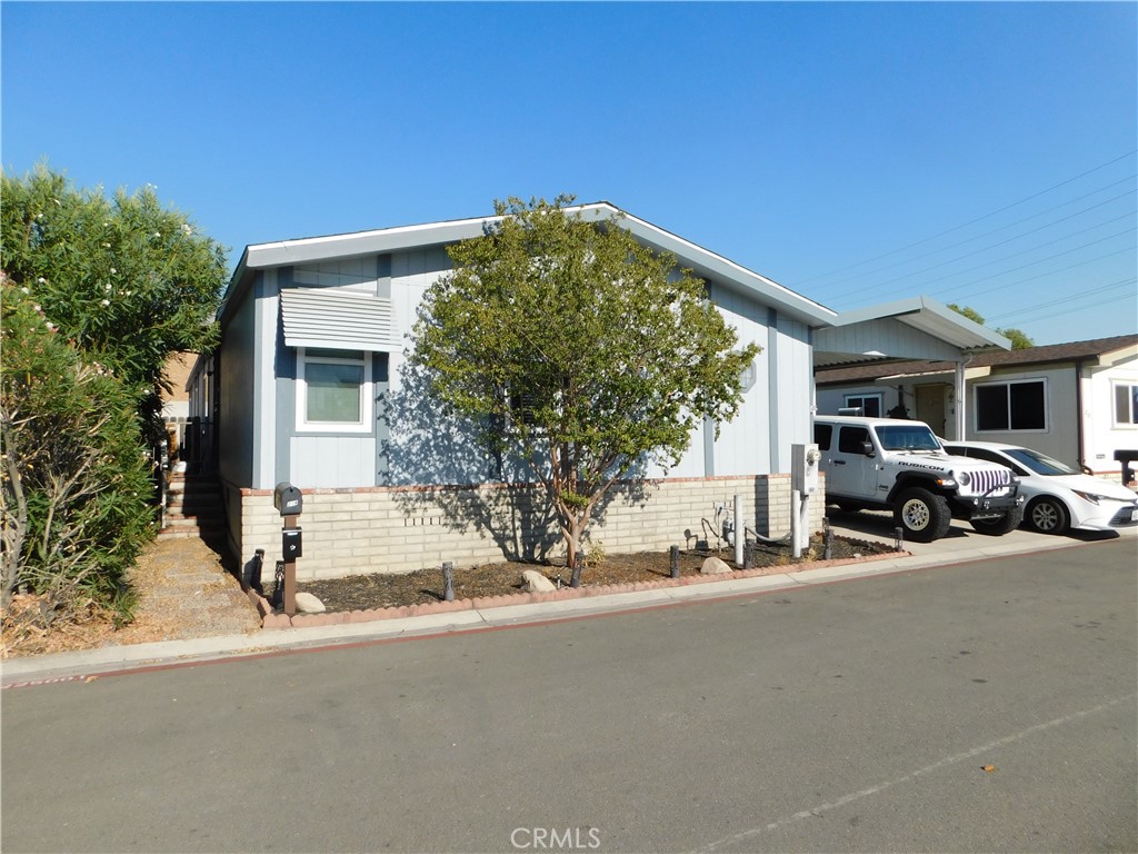 ~ABSOLUTELY GORGEOUS 4 BEDROOM SITUATED ALONG THE BACK PERIMETER OF THE PARK LOCATED IN THE ALL-AGE COMMUNITY OF HIGHLANDS MOBILE HOME ESTATES~RECENT UPGRADES INCLUDE BRAND NEW ROOF IN JAN 2024, NEW VINYL FLOORING IN 2023, ALL NEW "TINTED" DUAL PANE WINDOWS AND SLIDER DOOR INSTALLED MARCH 25TH 2025, REMODELED GUEST BATH MARCH 22ND 2025 INCLUDES REGLAZED TUB/SHOWER, NEW VANITY, TOILET AND FLOORING, NEW DISHWASHER IN JUNE 2025 AND NEW CEILING FAN IN DINING ROOM DEC 2023~SPRAWLING REMODELED GOURMET KITCHEN WITH CABINETS AND COUNTER SPACE GALORE...ALL SOFT CLOSE DRAWERS AND CABINETS, BEAUTIFUL QUARTZ COUNTER TOP WITH LARGE BAR AREA PLUS SEMI-WALK-IN PANTRY~ H U G E BRIGHT DINING ROOM / FAMILY ROOM OFF THE KITCHEN WITH CEILING FAN AND SLIDER DOOR TO THE BACK YARD~SEPARATE SPACIOUS LIVING ROOM~PRIMARY BEDROOM IS KING SIZE WITH LARGE WALK-IN CLOSET~PRIMARY BATH HAS BOTH A GARDEN TUB AND SEPARATE WALK-IN SHOWER WITH ENCLOSURE PLUS A LARGE LINEN CLOSET~BEDROOMS 2 / 3 / 4 ARE ALL GOOD SIZE ROOMS~REMODELED HALL BATHROOM HAS A TUB/SHOWER~SEPARATE LAUNDRY ROOM WITH PLENTY OF STORAGE CABINETS...LAUNDRY ROOM FRIDGE INCLUDED~PERFECT SIZE PRIVATE BACKYARD WITH CONCRETE PATIO~SHED~2-3 VEHICLE COVERED CARPORT~***CALL FOR A TOUR, YOU WILL DEFINITELY BE IMPRESSED***