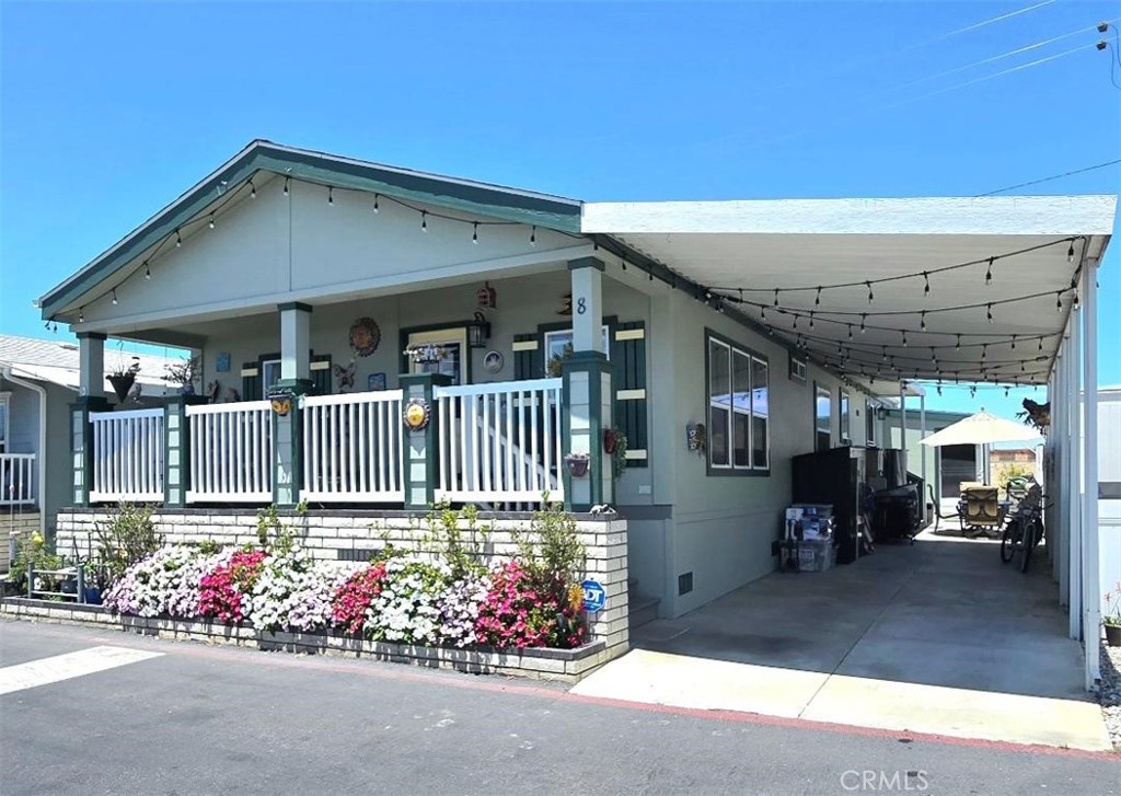 Newer 2017 Beach house!!! Across the street from the OCEAN!!! This Awesome house is in the lovely, “Huntington by the Sea” gated community, look no more! Walk to the beach in 3 minutes!!! Gorgeous open floor plan, with giant living and dining room. This beautiful home is over 1,488 sqft. 3 bedrooms and 2 bathrooms. This home is light and bright and includes Refrigerator, dishwasher, Washer and dryer and A/C with laundry room. Carport attached to the home. Guest parking is also available. UPGRADES INCLUDED: Front of house landscaped. Water irrigation system installed. Shed finished and flooring installed. 54’x6’ new white vinyl fence with lattice on top and gate on side of house between $5k. Replaced front door. Custom handmade stain glass window.. Front door camera. Inside and outside painted November 2023!. ADT security system. Installed new 3ton, A/C system with Senis smart thermostat (app-based software so can be controlled from a smart phone. Draperies and custom curtain rod holders fitted to 3 windows in front room. Front room window overlooking entry - wooden pull down covering installed. Dining room / Living Room - custom floral draperies on custom curtain rod in living room with matching floral drapery and valance in dining room. Master bedroom - window over bed is a wireless remote control operated fabric covering. Master Bedroom: 2 windows facing rear. Replaced shower/bath hardware with new fixtures (replumbed the wall to increase efficiency.) Replace the light fixture with glass chandelier. Custom handmade stained-glass window installed over sink -flowers and hummingbird’s theme. New Samsung Beverage Center refrigerator., Ceiling fans installed. DIRECTV satellite dish wired to hub. One Closet made into nook to fit dresser and storage 2024 $13K upgraded, custom shower/soaker tub (60x36x19) installed with new fixtures, 4 corner shelves, and double curtain rod - tile - silver white marble tub is extra wide and includes grab handles. An upper deck can be built over the carport to have amazing views from your home. The monthly park lease is only $3,677.00 a month which includes access to the newly upgraded community clubhouse, dog park, pool, hot tub, game room and full gym all located in the park’s private gated community with private security patrol. Located down the street from the famous Huntington Beach Pier and the new "Pacific City" with new shops and restaurants. 1-year full home warranty!!!