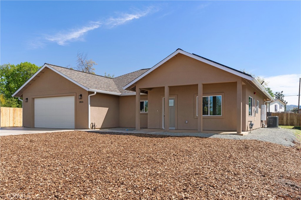 2 BEDROOMS, 2 BATHROOMS AND A DEN WITH THE OPTION TO CONVERT TO A THIRD BEDROOM. Welcome to 1924 Crandall Way, a home that truly embodies Paradise. Built by well-known and reputable local builder Martin Construction. This stunning home is located off of Pentz Road - just minutes from Oroville Lake while simultaneously only a few minutes from town for your everyday convenience. When you step inside, you will be greeted with a well thought out mud bench with coat hooks and cubbies on the lefthand side. As you walk in you will find the open concept floor plan - an entertainer's dream. Throughout the house you will find LVP (luxury vinyl planking) flooring, tasteful ceiling fans, recessed lighting, and 8 panels of OWNED SOLAR. The jaw-dropping kitchen features a walk-in pantry, knotty alder custom-built cabinets, quartz countertops, and a spacious island. The kitchen is fully equipped with a dishwasher, microwave/hood, a gas range and oven, as well as plenty of cabinets for storage space. The split-bedroom layout provides privacy within the house - the primary suite tucked in the back of the home. The primary suite features dual closets, outdoor access to the backyard, as well as an en-suite bathroom that includes a walk-in closet and walk-in tile shower, complete with a tile bench. The laundry room is located between the primary suite and fully insulated garage. In the other half of the house, you will find the secondary bathroom with a linen closet and shower/tub combination, the second bedroom, and the den. This charming new build is move in ready - be sure to schedule your tour today to see all this home has to offer!