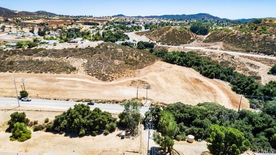 READY to GO!  FOUR (4) contiguous flat lots, approximately 3/4 of an acre of usable land! The seller has done most of the upfront footwork & expense to make this land "Ready to Build"! Active Working Well ($25k to $30k value included), Very recent percolation test ($4,500 value included) Land Survey with site plan that shows elevations ($4,000 value included) Electric available very close by!  This is your opportunity to build a home or bring in a manufactured home with a huge head start!  Located just North of Bundy Canyon in between the 15 & 215 freeways it is close to major new developments, excellent schools, shopping, restaurants & parks!  This land is right in the line of future Menifee progress!  Great opportunity to invest in your future dream home or build & sell, lots of upside!  Drive by today, these wonderful lots will not last long! Property is North of Bundy, enter on Cottonwood heading North, dirt road that may be paved at some point in the future, the lots are at the Northeast corner of Olive & Spruce.  Drive by anytime!