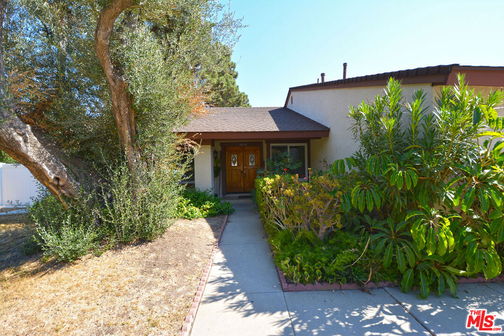 Welcome to this beautifully updated single-story home in the heart of Thousand Oaks! This spacious 4-bedroom, 2-bath residence features a bright open floor plan with vaulted ceilings, wood flooring, and a cozy fireplace in the living room. The updated kitchen includes granite countertops, stainless steel appliances, and ample cabinetry. Both bathrooms have been tastefully remodeled. Enjoy indoor-outdoor living with sliding glass doors leading to a large private backyard, perfect for entertaining or relaxing. Additional features include central A/C and heat, dual-pane windows, a 2-car attached garage, and laundry hookups. Located in a quiet neighborhood close to award-winning schools, parks, hiking trails, shopping, and dining. HOA community with greenbelts and walking paths.
