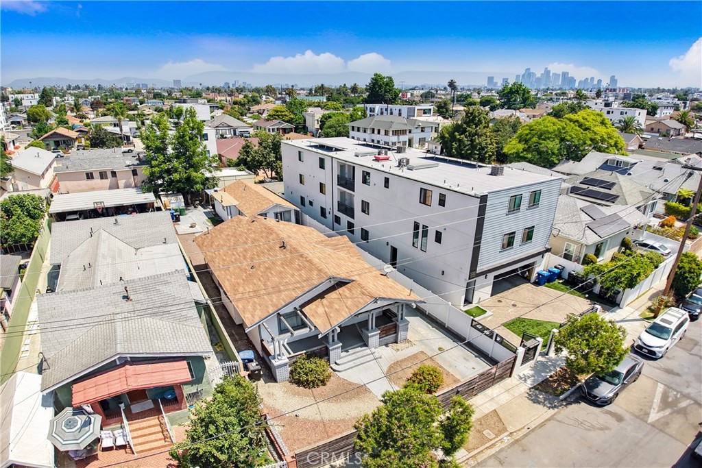 Back on Market and Priced to Sell!! Gorgeous Duplex delivered with 1 Three-Bedroom Unit VACANT and a rear One-Bedroom Unit currently occupied. This property is comprised of 2 separate homes on a lot, owner's home is 3bd/1bth and 2nd home features a large 1bd/1bth. Property has its own private gated entrance with parking, storage room, and stunning new yard. Homes have fresh paint throughout, new stainless-steel kitchen appliances, counter tops, new bathrooms, new laminate/tile flooring, windows, LED recessed lighting, walk-in closets, beautiful landscaping, and laundry rooms. Ideal property for owner-occupant, investor or developer!