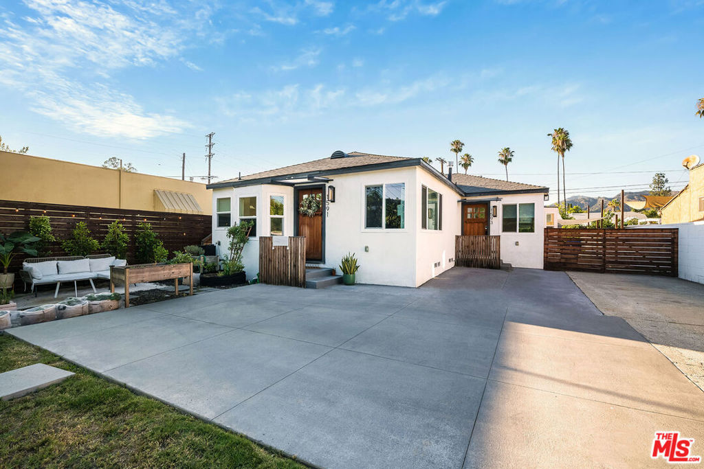 This beautifully updated 3-bedroom, 2-bath gem sits in a stylish duplex right on Yosemite Blvd right in the heart of Eagle Rock. You'll be just minutes from popular cafes, restaurants, and all the local charm this neighborhood is loved for. The moment you step inside, you're greeted by sunlight streaming through oversized windows, filling the open living and dining space with warmth. A cozy fireplace is the heart of the room perfect for quiet evenings or gathering with friends. The kitchen blends right into the space, with brand-new cabinetry, gorgeous countertops, stainless steel appliances, and in-unit laundry hookups. The breakfast bar is just waiting for Sunday pancakes or late-night chats. Each bedroom has its own personality and charm, with mirrored closets and plenty of space to make it your own. Throughout the home, you'll find beautiful wood floors, central heating and AC, and thoughtful touches that make it feel both modern and welcoming. Step outside and you'll love having a fresh front yard for your morning coffee, plus a large enclosed backyard ready for BBQs, gatherings, or a peaceful evening under the stars. Behind the remote-controlled security gate, you'll find 1 private parking spot for added convenience and peace of mind. And here's the best part the owner covers water and professional gardening, so you can spend your time enjoying your home instead of worrying about upkeep. Welcome home!