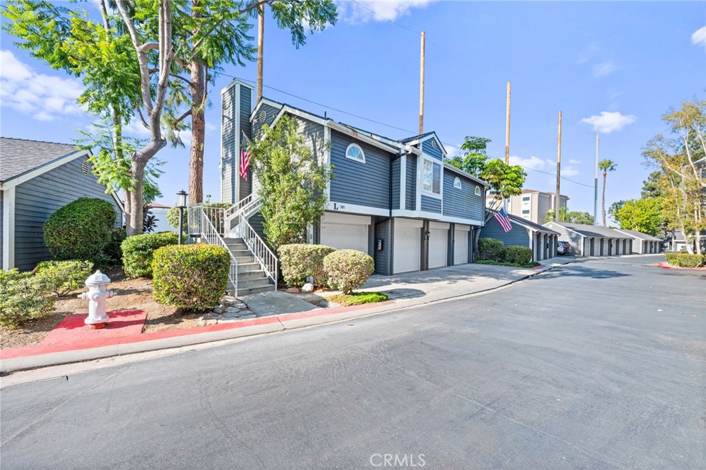 Welcome to one of the most unique homes for sale in the Newport Landing community. This rare carriage unit is one of only three in the entire neighborhood. Meaning it has no shared walls with any neighbors. Adding to its exclusivity, it comes with two full-size garages attached to the home, a true rarity here. Inside, you will find two spacious bedrooms, two full bathrooms, real hardwood flooring, a beautiful fireplace, and abundant natural light throughout. The kitchen features granite counters, new appliances, and peaks into the dining room. From the dining room you’ll exit a large sliding door leading to a charming back patio, here you can enjoy an incredible view of the Vanguard College baseball field. Taking the steps down you will find a quaint and maintained backyard space with room for outdoor dining and BBQing. The community offers two pools, two Jacuzzis, lush landscaping, and nightly security sweeps for peace of mind. There are plenty of walking and biking paths, and the location is just unbeatable. Minutes to Hoag Hospital, John Wayne Airport, and a wide selection of excellent shops, restaurants, and activities. Additionally, a short bike ride will take you to the weekly farmers market or OCC. This is not your typical condo, flagship unit opportunities like this do not come around often.