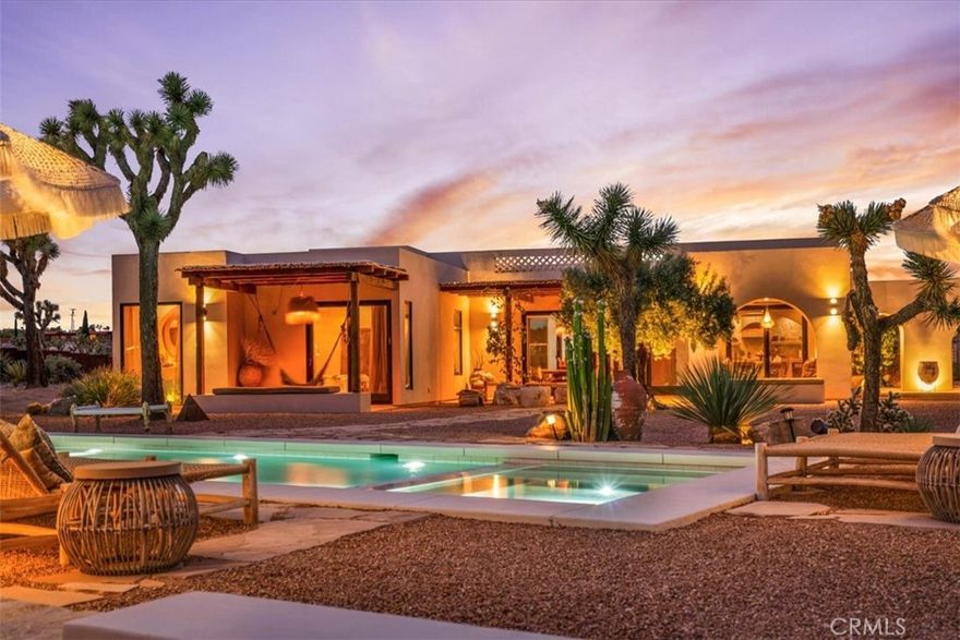 Step into your own private sanctuary in the heart of Yucca Valley—a stunning furnished Moroccan desert-inspired retreat that blends modern luxury with timeless design. This 2-bedroom, 2-bathroom architectural gem spans 1,363 square feet and sits on a serene 2.3-acre lot, offering total privacy and an unmatched desert living experience. From the moment you enter through the electric gate, you’re welcomed into a fully fenced oasis surrounded by native desert landscaping and curated stone walkways. Inside, you'll find sleek concrete floors, custom stone accents, built-ins, and thoughtfully designed living spaces that open seamlessly to the outdoors. The home features private patios, a tranquil inground heated salt water pool and spa, an outdoor fire pit, and shaded lounging areas—perfect for entertaining or unwinding under the stars. New modern architecture is complemented by mini splits for year-round comfort, while a carport adds function and more outdoor opportunities. This is more than just a home—it's a destination. Ideal as a luxury vacation getaway, high-end rental, or full-time desert retreat. Don’t miss the chance to own this truly one-of-a-kind property where style, privacy, and natural beauty meet.
