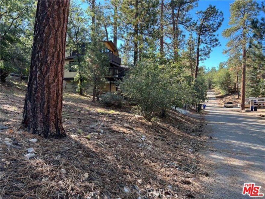 Ready to go! California dream is awaiting you.  With approved plans and permits this wonderful and affordable 5,000 sq. ft. lot is located on a quiet street close to two Big Bear skiing areas.  Just bring your contractor and build your dream home or cabin.  All utilities are near by.  Beautiful area with trees, peace and tranquility.  Part of National Forest and hiking trails. Streets are paved for access, close to Hwy 38, lake, village, shops etc.