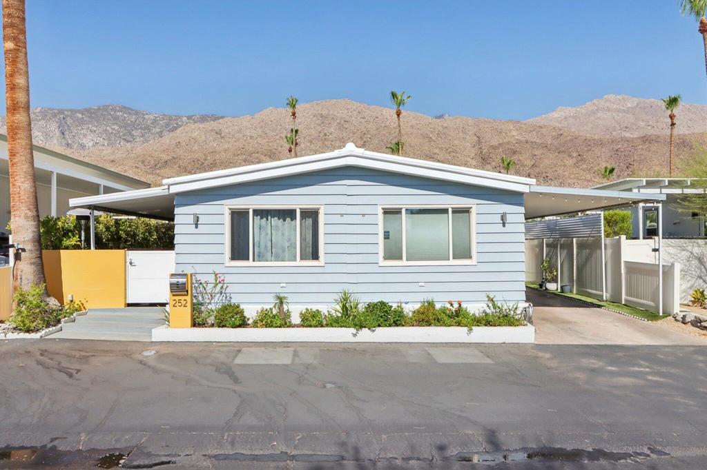 Welcome to 252 Lei Drive, a beautifully updated 2-bedroom, 2-bath home with a den in the highly sought-after Palm Canyon Mobile Club. Enjoy scenic views of the surrounding Palm Springs mountains, a brand new A/C system installed in July 2025, and energy-efficient features like thick insulation and a newly coated reflective roof. Inside, you'll find a bright and modern living space with stainless steel appliances and a smart thermostat. The versatile den offers the perfect flex space for a home office or guest room. Residents of this vibrant, gated community enjoy access to a resort-style pool and spa, fitness center, dog park, and stylish clubhouse. Conveniently located just minutes from downtown Palm Springs shopping, dining, and entertainment.