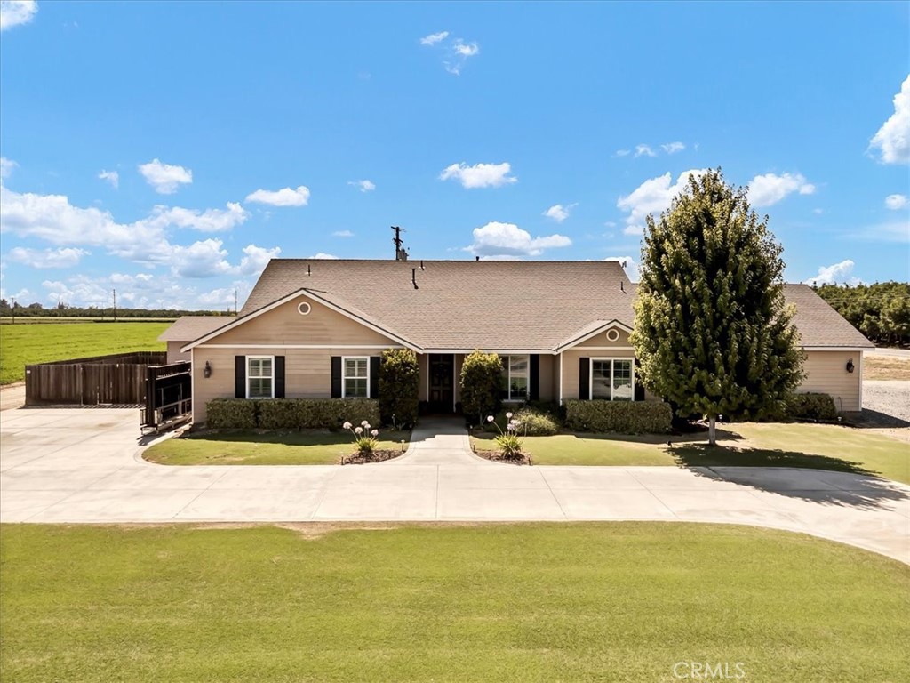 Welcome home to this beautifully updated 4-bedroom, 2-bath country retreat that blends modern functionality with rural charm. Situated in SE Visalia & surrounded by farmland views, this home welcomes you with lush curb appeal, a wide driveway, and a welcoming front porch. Inside, the open-concept floor plan boasts rich hardwood flooring, plantation shutters, and thoughtful upgrades throughout.
The entertainers kitchen features granite countertops, stainless steel appliances, and ample bar seating, flowing seamlessly into the dining and living areas - ideal for both daily living and entertaining. The large in-home laundry room adds convenience, while a bonus playroom offers flexible space for a home office, hobby room, or study zone.
The private primary suite includes a spa-like bathroom with dual sinks, a soaking tub, walk-in shower, and large closet. Three additional bedrooms provide comfortable living for family or guests.
Step outside to a fenced backyard designed for fun and relaxation - featuring a covered patio, in-ground trampoline, sandbox play area, and plenty of green space. And don’t miss the fully finished "man cave" with its own gym and movie theater setup - your ultimate retreat right at home. Leased solar adds energy efficiency, rounding out this turnkey property.
Experience peaceful country living just minutes from town, with space to spread out and enjoy. Schedule your private showing today!