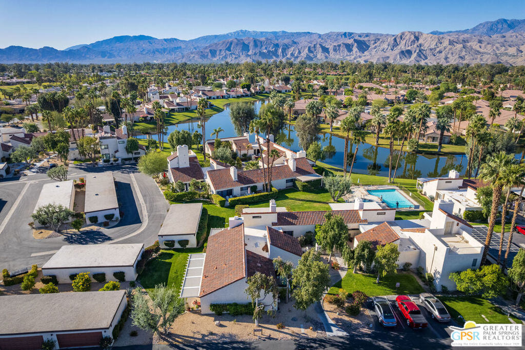 REDUCED - Experience the ultimate country club lifestyle in this beautifully upgraded, turnkey furnished, one-bedroom end-unit condo within the prestigious Mission Hills Country Club. Situated in a quiet location, just steps from community pools, this residence offers exceptional privacy and two inviting covered patios, complete with pergolas and a tranquil water feature, perfect for entertaining and relaxation. Inside, discover a light and airy open floor plan featuring vaulted beamed ceilings, creating a warm and spacious ambiance. Recent renovations include new flooring, stainless steel appliances, double-pane sliding doors and windows, custom plantation shutters throughout, upgraded lighting, a stylish fireplace tile surround, and a luxurious walk-in shower. A high-capacity washer/dryer adds to the convenience. The well-appointed kitchen seamlessly flows into the great room, ideal for open-concept living. This condo is perfect as a vacation retreat, permanent residence, or 30-day+ rental. A large, detached two-car garage, located just steps away, provides ample storage.Mission Hills Country Club, a guard-gated community in desirable Rancho Mirage, is renowned for its rich history and world-class amenities. Members enjoy access to three championship golf courses, 30 tennis courts (grass, clay, and hard), pickleball courts, croquet, a state-of-the-art fitness center, spa services, and multiple dining and social venues. Located minutes from Palm Springs International Airport, El Paseo shopping, and major entertainment, this is your opportunity to embrace the coveted Mission Hills lifestyle.
