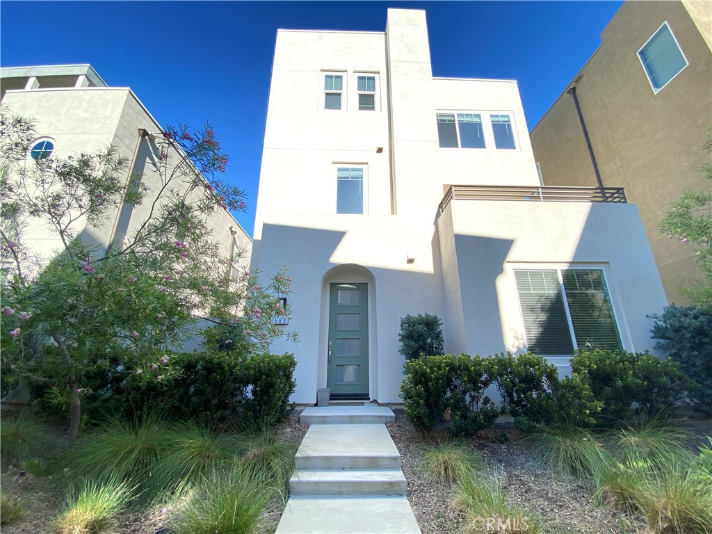 Welcome to this stunning 4-bedroom, 3-bathroom detached single-family home located in the sought-after Cadence Park neighborhood. This spacious residence offers over 2,154 sq.ft of open-concept living, with a highly desirable main-level bedroom and full bath – perfect for guests or multigenerational living.The chef’s kitchen features a large island, quartz countertops, full-height backsplash, stainless steel appliances, and upgraded cabinetry, flowing seamlessly into a bright and airy great room with expansive windows and recessed lighting. Upstairs, you'll find a luxurious primary suite with a walk-in closet and spa-inspired bathroom, along with two additional bedrooms, a full hallway bath, and a convenient upstairs laundry room.Enjoy private outdoor space ideal for entertaining, a 2-car attached garage, and access to resort-style amenities including multiple pools, parks, sports courts, trails, and community events – all within one of Irvine’s most dynamic master-planned neighborhoods.