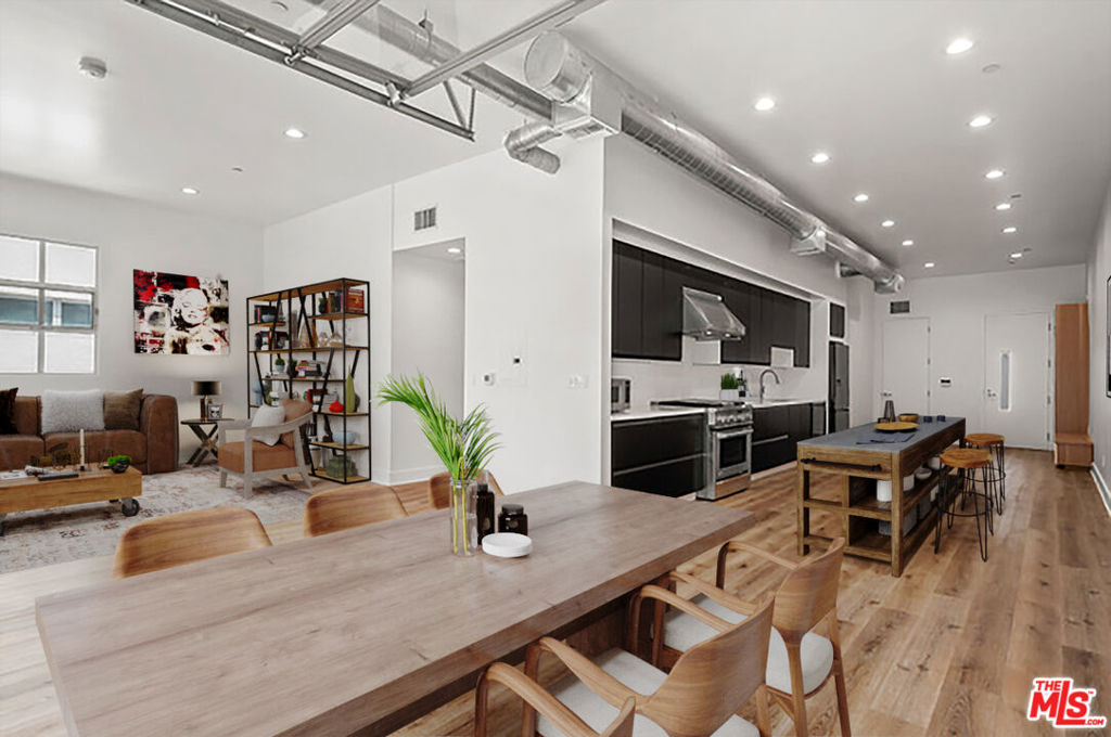 This immaculate and recently remodeled 1 bedroom/1.5 bath industrial loft is located at The Sailhouse Lofts, at the corner of Main St & Marine St. This architectural building is a unique industrial modern live/work concept, in the heart of Ocean Park's trendy restaurant and bar scene, above Gnarwhal Coffee, walking distance to the vibrant restaurants, bars and boutique shops along Main Street, Rose and Abbot Kinney. Remodeled extensively from top to bottom, this open concept/loft has custom built in cabinetry throughout, new chef's kitchen, new appliances, quartz countertops, charcoal colored kitchen cabinets, separate master bedroom suite with motorized black out shades, remodeled bathrooms, in unit washer/dryer, high ceilings, tons of natural light, and a rollup industrial door, which when opened, creates indoor outdoor flow to the private balcony with peek-a-boo ocean views. Various common area lounge/sitting areas are located throughout the outdoor areas, so sitting outside provides open breezy areas for conducting work or play. Located on the 3rd floor, this particular unit shares only one common wall, which adds to its overall privacy, and has 2 side by side secure designated parking spaces. Some photos have been virtually staged.