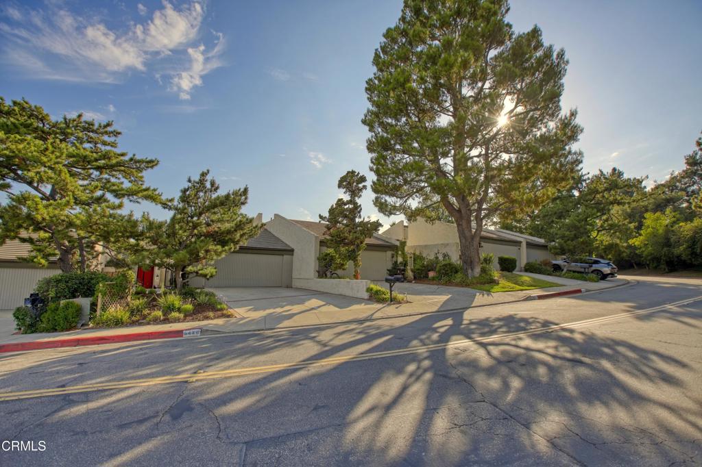 Nestled high in the foothills surrounding the La Canada Country Club, this updated three bedroom, three bath townhome has stunning unobstructed views of Downtown LA. Set back from the street, the formal entryway steps down to the open concept kitchen and great room, which features vaulted ceilings and large glass sliding doors that provide a direct sightline to the panoramic views. The updated kitchen includes a breakfast bar, stainless steel appliances, granite countertops and a large pantry area. Off the main living space is a versatile third bedroom with three-quarter bath that makes a great guest suite, den or work from home space. Upstairs you'll find a spacious primary bedroom suite with a walk-in closet, dual sinks and a gigantic double shower. The large second bedroom has built in storage and its own full bath. Finishing off the interior is a laundry area with included washer and dryer and an oversized attached two car garage. Best of all, the townhome features two large separate outdoor spaces: a private enclosed patio off the kitchen, and a huge extended patio off the great room. The covered back patio provides an extension of the indoor living space and is the perfect place to entertain while enjoying the gorgeous mountain and city views. Located in one of LA's most coveted and distinguished school districts, this townhome is ready and waiting for you. Welcome home to the peace and serenity of the foothills!