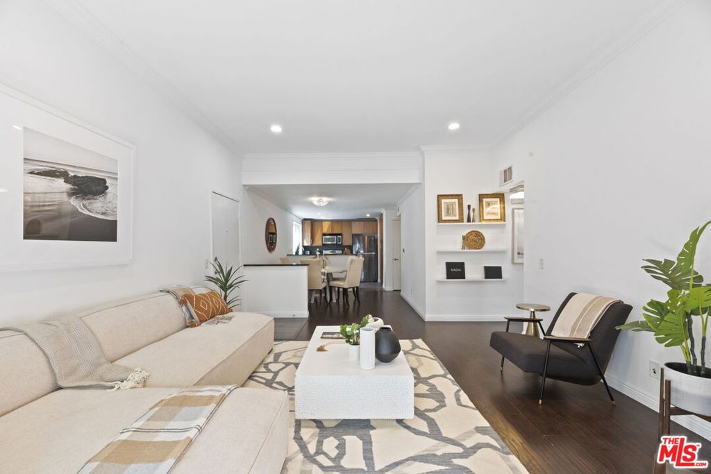 Coastal Elegance Meets Everyday Comfort. Just steps from the sand in the sought after coastal enclave of Playa del Rey, this inviting residence offers a harmonious blend of tranquility, convenience, and modern style. Nestled in a pristine, well cared for building, this 2-bedroom, 2-bathroom condo provides both privacy and luxury, featuring no neighbors above or below and just one shared wall. Inside, experience an open concept layout with high ceilings that create a naturally bright and welcoming atmosphere. The layout flows beautifully, with the kitchen seamlessly integrated into the main living space, ideal for everyday living and relaxed entertaining. Both bedrooms are well-proportioned, with the primary suite offering a private ensuite bath and extensive closet space designed for effortless organization. Additional highlights include hardwood floors, double pane windows, a new fireplace and HVAC system, in unit laundry, and ample closet space. Enjoy the added convenience of two dedicated parking spaces and a storage area. Residents have access to resort style amenities such as a pool, jacuzzi, sauna, gym, and BBQ area, which enhance the beachside living experience. With the shoreline just steps away, weekends can be filled with coastal strolls, ocean breezes, and the charm of Playa del Rey's vibrant cafes and shops. This property is more than a home; it's your gateway to the quintessential California beach lifestyle.