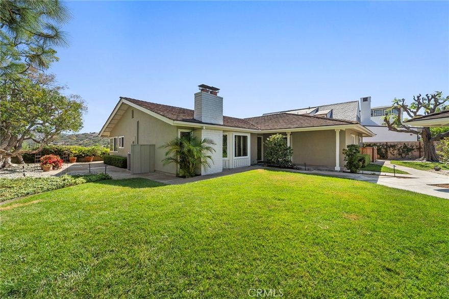 Discover the best of coastal living in the highly desirable Harbor View Hills South community. This sought-after single level floor plan features 4 bedrooms, approximately 2,400 square feet of living space, a 3 car garage, and an expansive outdoor setting designed for privacy and relaxation. Tucked away on a quiet cul-de-sac, the home welcomes you with a secluded entry courtyard offering endless possibilities for gathering or quiet reflection. Inside, vaulted ceilings and abundant natural light create a warm and inviting atmosphere that flows effortlessly between the living, dining, and kitchen areas. The kitchen is ideally positioned between the living and family rooms, making it the heart of the home. The spacious primary suite offers a private retreat, while the secondary bedrooms are generously sized and thoughtfully placed for comfort and versatility. Outdoors, enjoy a private sanctuary perfect for al fresco dining, entertaining, or simply soaking in the serene coastal ambiance. Located just minutes from pristine local beaches, top-ranked schools, and world-class shopping and dining at Fashion Island, this Harbor View Hills South residence offers the perfect balance of comfort, convenience, and coastal charm.