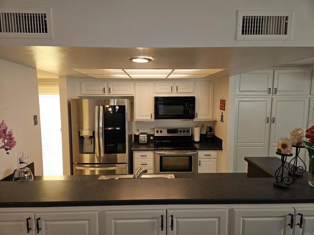 Bright & Spacious 2-Bedroom Townhouse in San Vicente Golf Resort Resort-style living awaits in this 2-bedroom, 2-bath townhouse located in Ramona’s desirable San Vicente Golf Resort community. With approx. 1,280 sq. ft., the open-concept floor plan features vaulted ceilings, abundant natural light, and a welcoming layout. The kitchen offers ample cabinetry and a breakfast bar that flows into the dining and living areas. The primary suite includes an en suite bath and balcony access, while the secondary bedroom is ideal for guests or a home office. Highlights include: One covered carport In-unit washer & dryer Private outdoor patio Community amenities: golf, tennis, swimming, dining & more Just down the street from San Vicente Golf Course, this furnished townhouse offers a low-maintenance lifestyle in a tranquil setting. Schedule your private tour today! (Contact agent for furnished details)