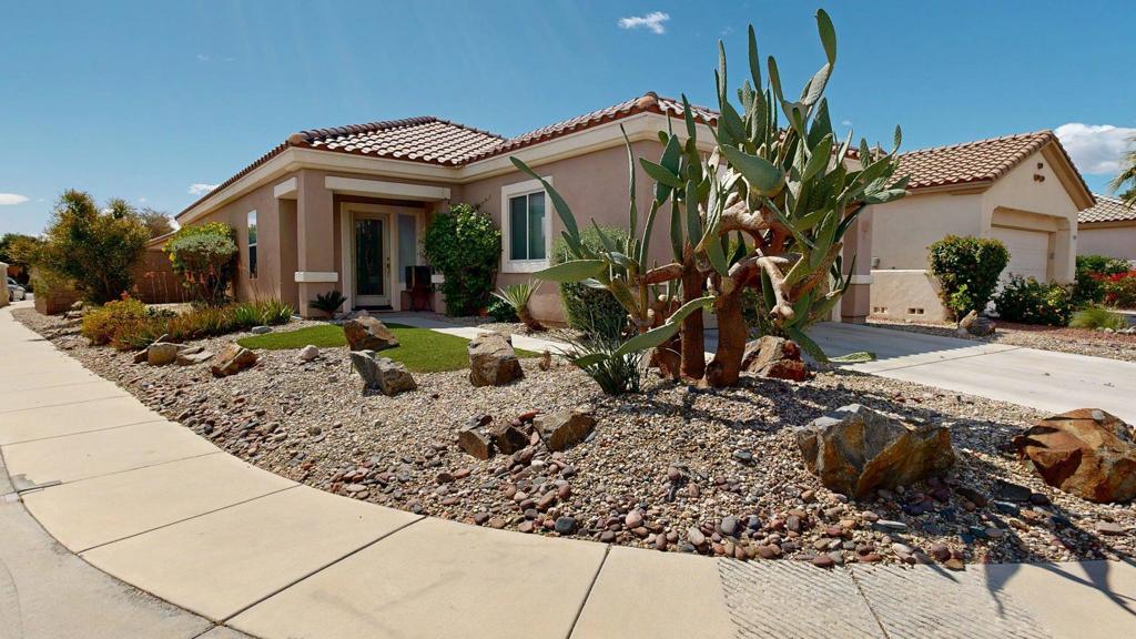 One of the largest backyards in the entire community--paired with rare access to a private pool and spa just down the street. This beautifully upgraded corner-lot home offers 2 spacious bedrooms, 2 full bathrooms, of open-concept living designed for comfort, connection, and easy indoor-outdoor flow.Set on one of only nine streets in Sun City Palm Desert with direct access to the private Newcastle pool and spa, this home is a rare find. The oversized backyard is a true highlight--an entertainer's dream and a peaceful escape all in one. It features low-maintenance native landscaping, pet-friendly smooth river rock that's gentle on paws, and a full misting system to keep the outdoor living area cool and enjoyable even in the summer. The living area is bright and welcoming, with large windows that let in the desert sunshine and provide views of the lush backyard.The kitchen features crisp white cabinetry, ample counter space, and a gas range, making it perfect for both daily use and entertaining. The seamless flow into the dining and living spaces invites connection and ease.The primary suite includes a walk-in closet, private en-suite bathroom with a walk-in shower, and modern fixtures. The guest bedroom is equally comfortable and versatile--ideal as a guest space, office, or hobby room. Both bathrooms include built-in bidets, adding a touch of comfort and luxury to daily living.Evenings are made magical thanks to a ceiling-mounted 4K projector and 126' retractable outdoor screen--perfect for watching sports, movies, or music under the stars. A private jacuzzi adds the finishing touch to this custom backyard retreat.Additional highlights include low-cost electricity from Imperial Irrigation District (IID), a covered patio for shaded lounging or dining, and the quiet privacy of a premium corner lot.Sun City Palm Desert is a nationally recognized 55+ community--named one of the top 10 places to retire in the U.S. by Money Magazine. With low HOA fees, award-winning amenities, and an active social calendar, this is one of the best values in the desert.
