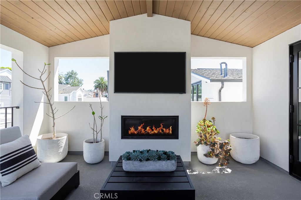 Set on a quiet street in the heart of Corona del Mar’s Village, 714 ½ Iris is a detached back unit that combines quality, natural light, and thoughtful design. Completed in 2021 by Sonil Construction, the home offers a refined coastal aesthetic with clean lines, premium finishes, and effortless indoor-outdoor flow.
The main level features an open floor plan filled with light, anchored by real hardwood flooring and a neutral palette that enhances the sense of space and calm. The kitchen is finished with quartzite countertops, stainless steel Thermador appliances, and custom cabinetry—designed for everyday living with a streamlined, elevated lifestyle.
Upstairs, the primary suite offers vaulted ceilings, a walk-in closet, and a spa-like bath with a Victoria + Albert soaking tub, walk-in shower, and dual sinks. A secondary bedroom and full bath are situated on the main level, maintaining complete privacy.
A private rooftop deck expands the living space, offering a place to unwind by the fireplace and enjoy the soothing sunset—or relax in the jacuzzi beneath open skies. The home is also prewired for a professional-grade sound and security system and secured with exterior gates equipped with keypad access, blending convenience with peace of mind.
With no shared walls, private garage access, and a walkable location near beaches, shops, and restaurants, this residence offers a sophisticated take on Village living—low-maintenance, well-appointed, and effortlessly connected to the best of coastal Orange County.