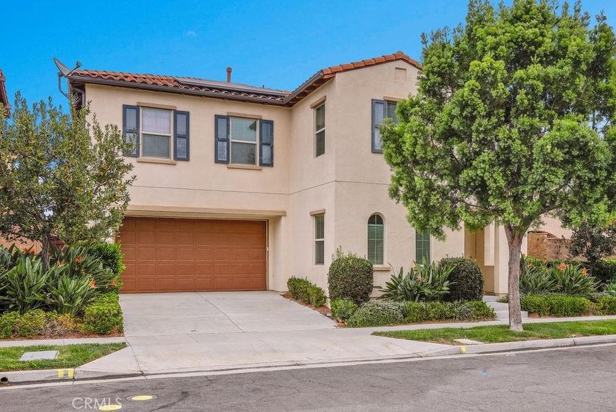 Stunning 2-Story Detached Home with Full Driveway! Colibri by Ryland Homes in beautiful Portola Springs! All the modern and efficient amenities such as solar panel system, tankless water heaters with an open, airy floor plan. Upgraded beautiful Wood-style plank flooring in the open & bright great room which encompasses the living, kitchen & dining area. Kitchen is well-appointed with quartz countertops, full height custom backsplash, stainless steel appliances and a large center island. A main bedroom, perfect for use as an office, is adjacent to a full bathroom. Upgraded plush carpet in living areas, large laundry room w/ linen storage and utility sinks, gorgeous master bathroom w/ quartz countertops and double sinks. Heading out to the back yard, you will love the large entertaining space & landscaped yard including the outdoor covered California room to lounge around. Enjoy the resort-style amenities featuring a community lap pool, tennis courts, numerous parks, hiking & biking trails and accessible to Award-Winning Irvine Schools = Portola Elementary School, Jeffery Trails Middle School, and the recently opened Portola High School.
