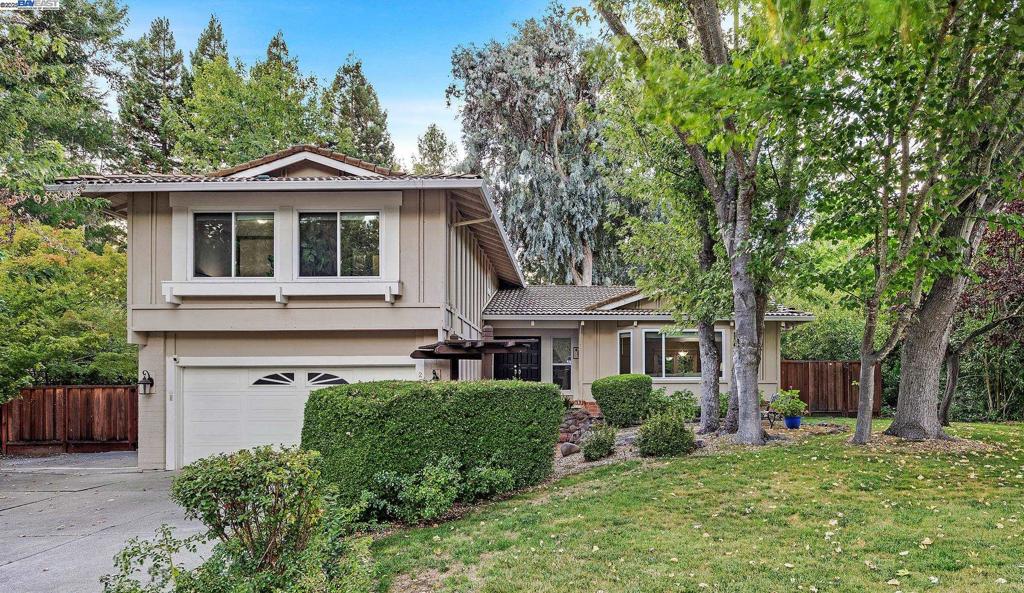 Welcome to 2240 Tahiti Drive Your Own Private Oasis! This beautifully maintained East-facing home sits on nearly half an acre in the highly desirable Country View neighborhood. Offering both charm and functionality, this split-level residence showcases vaulted ceilings, a gourmet kitchen overlooking the expansive backyard, a formal dining room, and two inviting living areas. Multiple sliding doors seamlessly blend indoor comfort with the serenity of the outdoors. Upstairs, retreat to the luxurious primary suite featuring sweeping views of the backyard, a beautifully updated bathroom with dual vanities, a large walk-in shower, and ample closet space. A downstairs half bathroom, full laundry room and generous two-car garage complete the functional layout. The backyard is the crown jewel designed for both relaxation and entertaining. Enjoy multiple patio decks, lush gardens, and the shade from mature trees that make it feel like your own private park. Host family gatherings, summer barbecues, or quiet evenings under the stars. It's also steps away from the community pickleball and basketball courts.The home offers an unbeatable location minutes to top-rated schools, City Center, parks, shopping, dining, and quick I-680 access. Don't miss your opportunity to own a one-of-a-kind home!