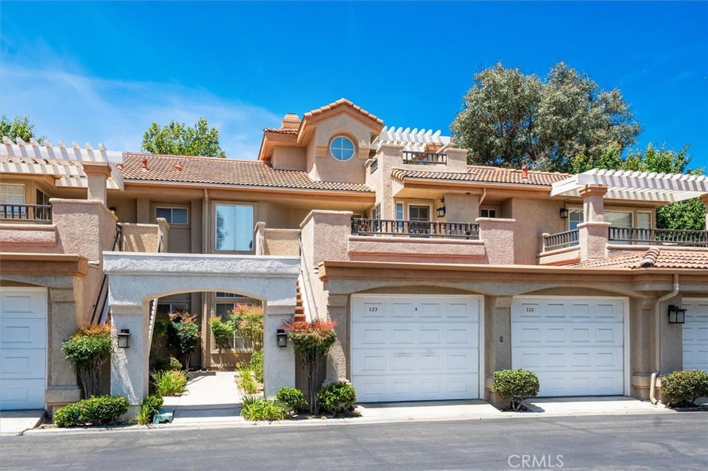 Welcome to Las Ventanas — one of Santa Clarita’s most sought-after gated communities — where this top-floor 2-bedroom + loft condo offers comfort, convenience, and endless potential. The kitchen features a window with a direct and open view to the living area, making the space feel connected while still defined. Step outside to not one, not two, but three private patios — perfect for enjoying your morning coffee, dining al fresco, or simply soaking in the sunshine. Additional features include in-unit laundry, a private one-car garage, and an assigned covered parking space. The versatile loft adds extra room for a home office, gym, guest space — or all three. But what truly sets this home apart is its unbeatable location. Just steps from your front door, you’ll find all the essentials, including a grocery store, restaurants, pharmacy, yoga studio, bank, and more. You’re also just minutes from major shopping destinations, city tennis courts, and expansive parks. And thanks to the scenic Paseo trails that surround the community, it's easy to get around on foot or by bike without relying on your car. Las Ventanas also offers residents plenty of guest parking, and a sparkling community pool. Whether you're looking to create your first home or invest in a low-maintenance lifestyle close to it all, this condo offers the perfect opportunity. This home is truly Valencia living at its FINEST!