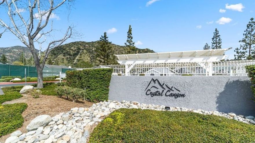 NOW VACANT -- GO ANYTIME. Downstairs end unit, includes two primary suites. LOWEST LIST PRICE IN THIS COMPLEX FOR A 2 BATHROOM 1085 Square foot UNIT. Azusa is a gateway to the San Gabriel Mountains National Monument and the Angeles National Forest, offering abundant opportunities for hiking, mountain biking, camping, and fishing. San Gabriel River 38-mile trail provides a scenic route for walking, biking, and enjoying the natural beauty of the area.  Azusa River Wilderness  60-plus-acre park offers more recreational space and a chance to connect with nature.

The city has Metro Gold Line stations and freeway access, making it convenient to get around.  Home to Azusa Pacific University which offers 66 bachelor’s degrees, 40 master’s degrees, 32 certificates and credentials, and 9 doctoral programs. Nextdoor you will find Citrus College  a 2-year, public community college. Elevate your golf game to new heights at the Updated Azusa Greens!   Crystal Canyon, a three-village, master-planned development.  This home is in the second village of 142 condominiums with units of 890 sqft, 1007 sqft and 1085 square feet (as is 202 Evergreen with 2  ensuites), Relco Industries developed this project at the entrance to Angeles National Forest. Among common amenities for each village you will find swimming pools, spa and sun deck  plus two tennis courts.