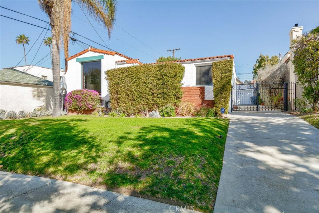 Welcome home to this beautifully remodeled Spanish-style gem in the prestigious Rossmoyne neighborhood of Glendale.
From its inviting curb appeal and decorative tiled stairs, you’ll step into a spacious living room featuring a large picture window, coved ceiling, and an original Batchelder tile fireplace. The formal dining room flows seamlessly into the remodeled kitchen, which offers ample cabinetry and an adjacent laundry area. Enjoy a cozy breakfast nook that overlooks the front yard—perfect for your morning coffee.
The primary bedroom features a remodeled en-suite shower and original tile flooring. Two additional generously sized bedrooms are located on the opposite side of the hallway, providing privacy and comfort. A fully remodeled second bathroom completes the interior layout.
Step outside to a beautifully manicured backyard, highlighted by a bougainvillea-covered pergola—ideal for outdoor dining and entertaining. The home also includes a two-car garage, additional laundry hookups in the garage, and plenty of street parking.
Washer and dryer are included and conveniently located in the kitchen area. The interior has been newly painted, and a new garage door has been installed.
Located just minutes from The Americana at Brand, Whole Foods, Trader Joe’s, popular restaurants, and entertainment venues. Enjoy easy access to major freeways, Downtown LA, and nearby studios. All within the boundary of award-winning schools.