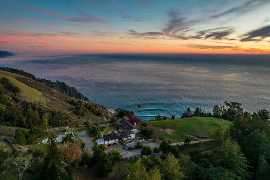Dating back further than the scenic, winding path of Highway One, this six-parcel, 350-acre coastal ranch presents a colorful past and an even brighter future. Six unique homes, a magnificent redwood grove, and a private beach inhabit this serene stretch of land nestled between the canyon and cliffs of Big Sur. A private access road connects all of these homesites, where expansive decks overlook the diverse terrain and secluded paths allow for a lifestyle centered on the outdoors. With its use of rustic stone and wood, the original homestead proudly exhibits its rich history, while the more modern buildings gracefully complement it. Together, the property offers 12 bedrooms, 10.5 bathrooms, 2 pools (indoor and outdoor), and innumerable ocean vistas. Cherish the calming effect of year-round streams, hikes up Vineyard Canyon, and quick access to Highway One and fine dining - Post Ranch Inn and Nepenthe. The sprawling property leaves plenty of room for potential development. Whether you improve the family compound or create a new coastal masterpiece, an opportunity like this occurs once in a century. We look forward to welcoming you to the Newell Ranch!