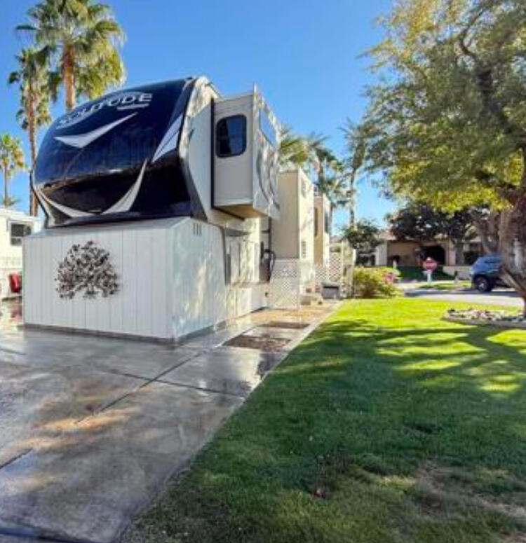 LOT 713 2017 Grand Design Solitude Heres a truly special opportunity that I think many of you will absolutely love. I've got an incredible lot available, and it truly is what dreams are made of for anyone looking for that perfect blend of convenience and relaxation.Step out your door, and you're just a super short walk away from the golf starter shack - perfect for those early morning tee times! The ES clubhouse, where all the fun events and social gatherings happen, is also practically on your doorstep, as are the fantastic pickleball courts. So many ways to stay active and connected!This isn't just any lot; it's a wonderful corner spot that offers the best of both worlds - lovely privacy and an abundance of beautiful sunshine to brighten your days. Plus, that popular 'Satellite D' area is just a quick, easy stroll away.This package includes a fantastic 2017 Solitude RV! It's been recently given a gorgeous exterior paint job by Jags, ensuring it's not only looking sharp but also perfectly compliant with Outdoor resort standards. Inside, you'll love the large front window, designed to let you soak in all the stunning views our beautiful resort has to offer. This entire setup is an absolute gem, and I've priced it to ensure it finds its perfect owner quickly. If you've been waiting for that ideal spot this is absolutely it. Don't let this amazing opportunity slip away!outdoor type kitchen, small fire table, misc outdoor furniture, dog house and steps all included.