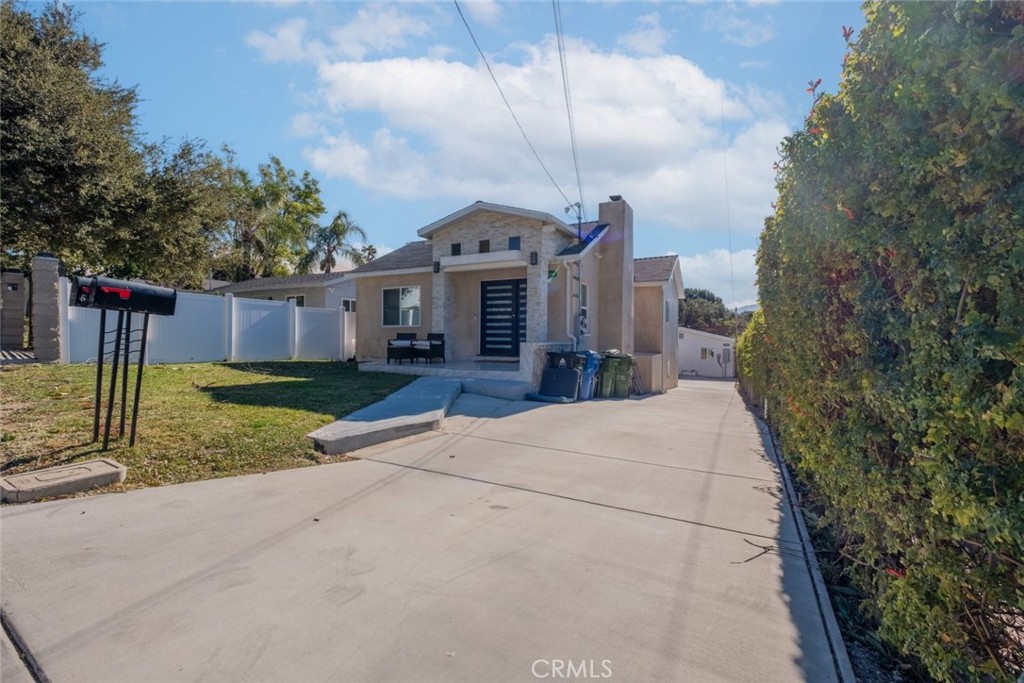 Discover this unique property offering two homes on a spacious lot of nearly 7,700 square feet in the heart of Tujunga. With a front house and a newly constructed 3-bedroom ADU (built in 2022), this property provides an excellent opportunity for multi-generational living, rental income, or extended family accommodations.
The front house features 2 bedrooms, 1.5 bathrooms, and 1,028 square feet of living space. Highlights include a spacious recreation room, a beautifully designed kitchen with a quartz stone island, abundant cabinetry, and durable stainless steel appliances, including a range stove and dishwasher. The living room boasts a charming fireplace, custom decorative moldings, and recessed LED lighting throughout. The bathrooms feature modern fixtures, a custom glass shower enclosure, and a sleek 60-inch wall-mounted vanity.
The ADU is a stunning 3-bedroom, 2-bath home with a luxurious primary suite that includes a full bath and decorative tile finishes. This brand-new construction offers modern amenities such as double-pane windows, central air and gas heating, and laminate wood flooring.
The outdoor space is just as impressive, with a fully landscaped backyard featuring a new sprinkler system. The large lot provides ample space for relaxation, entertaining, or future projects.
This property is an incredible find, combining comfort, modern design, and versatility on a rare large lot in Tujunga. Don’t miss the chance to make it yours!