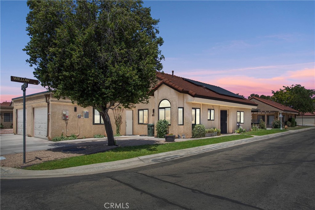 Welcome to this beautifully updated, move-in-ready home in the desirable 55+ guard-gated Jess Ranch community. Featuring 2 bedrooms and 2 bathrooms, this home offers newer Luxury Vinyl Plank flooring, tile in kitchen and baths, and an upgraded kitchen with granite counters, all-new cabinets, fixtures, and included appliances. The spacious primary suite has patio access, a walk-in closet, and a remodeled en-suite with dual sinks and a walk-in shower. Guest bedroom and bath offer flexibility for visitors, office or hobbies. Other upgrades include new windows, blinds, lighting, garage roof, and more. Enjoy affordable solar with no electricity bill, plus a covered Alumawood patio, low-maintenance yard, and convenient access to shopping, dining, and entertainment at Jess Ranch Marketplace.