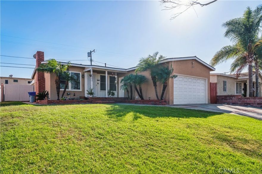 Welcome to this inviting 3-bedroom, 1-bath home that has been beautifully updated and thoughtfully maintained. The kitchen features modern grey cabinetry, granite countertops, stainless steel appliances, and a gas range, perfect for preparing your favorite home-cooked meals. The open layout flows seamlessly into the living areas, highlighted by warm wood flooring and an abundance of natural light throughout. The bathroom has been completely remodeled with a clean, contemporary design showcasing classic subway tile, a stylish vanity, and a custom-patterned floor.Step outside to a backyard designed for relaxation and entertaining. Enjoy outdoor dining under the covered patio, unwind around the cozy firepit lounge area, or take in the lush greenery and mature banana trees. The landscaped yard combines grassy areas with low-maintenance stone accents, offering both beauty and practicality.This home perfectly blends comfort, convenience, and California style living and is move-in ready for its next owner.