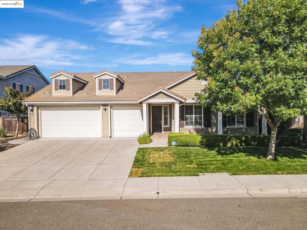 Single-story perfection in Magnolia Park! This beautifully maintained 4-bed, 2.5-bath home offers 2,720 sq ft of spacious living on an 8,500 sq ft lot in one of Oakley’s most desirable neighborhoods. Soaring ceilings, hardwood floors, and a dramatic entry set the tone, while the expansive kitchen—with large island and walk-in pantry—flows seamlessly into open living areas. The private primary suite features French doors to the yard, a soaking tub, and a huge walk-in closet. Three additional bedrooms are tucked in a separate wing for privacy. Enjoy indoor-outdoor living with two sliders opening to a stamped concrete patio, garden beds, and lush lawn. A 3-car garage with epoxy floors completes the package. Close to parks and trails—this one checks all the boxes!