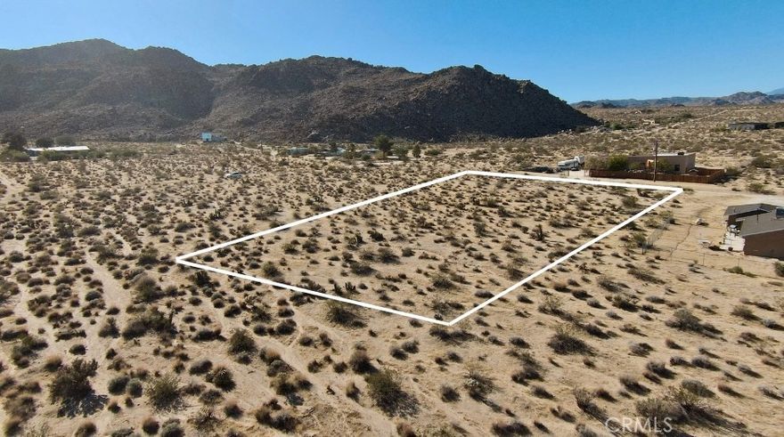 Discover 1.25 acres of untouched desert beauty with sweeping, priceless views in the highly coveted Indian Cove area of 29 Palms. This property delivers that rare “national park in your backyard” feeling, with dramatic rocky mountains rising just to the south—your daily reminder of why people fall in love with the high desert. Outdoor lovers will appreciate being just minutes from world-class hiking, and only a 15-minute drive to the Joshua Tree National Park West Entrance. Even better, you're a quick 5-minute drive to downtown Joshua Tree, where you’ll find coffee shops, boutiques, restaurants, and all the local charm this artistic community is known for. Whether you're dreaming of a private desert retreat, planning your first investment, or exploring development opportunities, this parcel offers endless potential. Come walk the land and imagine the possibilities. Buyer to verify availability of all utilities during due diligence. Lot lines in photos are approximate. Address is fictitious and provided solely to assist with locating the property.