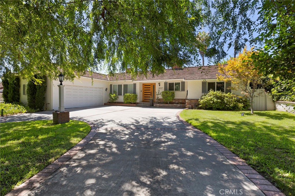 Stunning home in Arcadia’s coveted Highland Oaks neighborhood. This remodeled residence offers 3 bedrooms, 2 bathrooms, plus a versatile bonus room that can serve as an office, playroom, fitness area, or 4th bedroom. The spacious floorplan is filled with natural light. The living room features a fireplace and large windows with views of the backyard and pool. Located on a quiet street, the home offers a peaceful setting with lush surroundings. Updated in 2018 with white oak hardwood floors, dual pane windows, Hunter Douglas custom blinds, blackout shades in the bedrooms, and Toto bidet toilets in both bathrooms. The kitchen includes a Samsung stove, Frigidaire refrigerator, Bosch dishwasher, and matching vent hood. Ample storage and large closets throughout. The backyard is perfect for relaxing by the pool or gathering with family and friends. Additional features include a circular driveway with Tesla charger and an attached 2 car garage. Close to award winning schools, cafes, restaurants, and shops. Unfurnished. Tenant responsible for utilities and renter’s insurance.