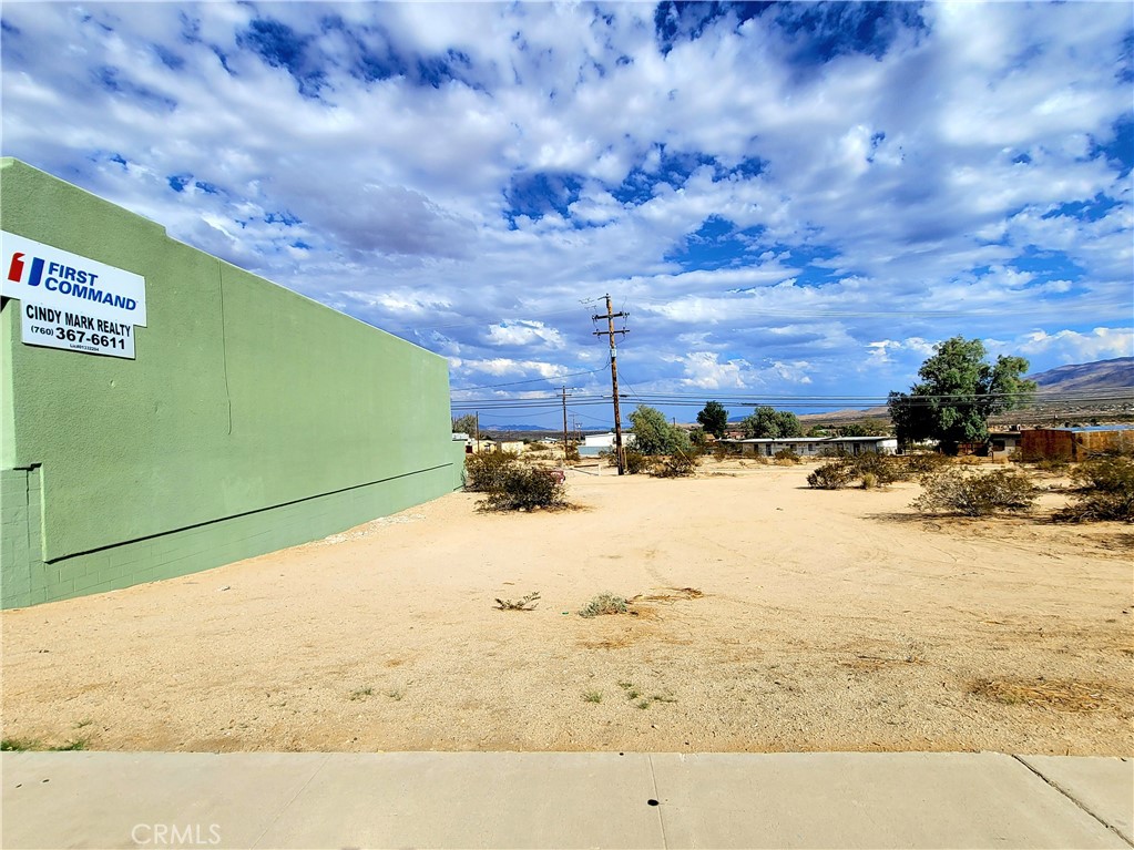 Commercial lot for sale near the high traffic area of 2 Mile and Adobe Rd. High visibility and access. 140 feet by 63 feet. All utilities are available. Back ally access as well. Now is the time to invest in 29 Palms! This spot is on the main path to the USMC Base and the East Entrance to the Joshua Tree National Park. Street parking and alley parking are available.
