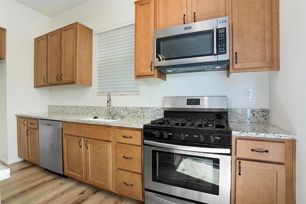 Welcome to this beautifully maintained corner-unit townhome located in the heart of Otay Ranch in the highly sought-after community of Suwerte. This spacious 2 bedroom 2.5-bathroom home features an open-concept living space with abundant natural light luxury vinyl plank flooring and a modern kitchen equipped with quartz countertops stainless steel appliances and a large island perfect for entertaining. Upstairs you’ll find generously sized bedrooms including a primary suite with a walk-in closet and a dual-sink vanity. Additional highlights include an attached two-car garage upstairs laundry and energy-efficient features throughout. Residents enjoy access to resort-style amenities including a pool spa playgrounds and scenic walking trails. Conveniently located near Otay Ranch Town Center top-rated schools restaurants and major freeways this home offers the perfect blend of comfort style and location.