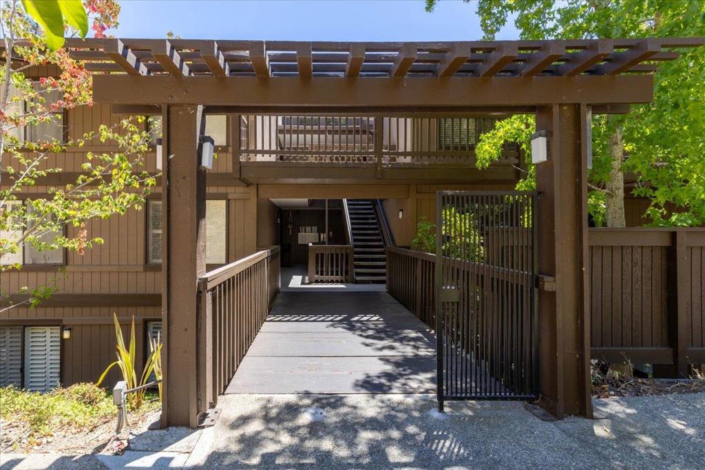 Escape to your very own personal sanctuary in this 3-bedroom, 2-bath ground floor condo that seamlessly blends nature with convenience. Imagine a Tahoe-like retreat, nestled amidst lush parks, scenic trails, and frequent deer visits, yet only moments from the energetic vibe of San Carlos downtown and nearby freeways. This very private unit is strategically positioned at the end of the building and away from the street. With only one shared wall, sunlight pours in from three sides, illuminating the space and enhancing the cozy warmth provided by the living room's fireplace during cooler months. Step outside through sliding glass doors to a private patio, perfect for a peaceful morning coffee. The spacious primary bedroom features a walk-in closet with a custom organizer. Indulge in the complex's resort-style amenities: four pools (two child-friendly), two tennis courts, a clubhouse, and a play area for children. For outdoor enthusiasts, nearby parks like Crestview and Pulgas Ridge Open Space Preserve offer endless adventures. After a day in nature, explore the lively downtown with trendy restaurants, unique shops, a vibrant farmers market, and events like Hometown Days and the Art & Wine Faire. Embrace the active, vibrant lifestyle of your dreams!