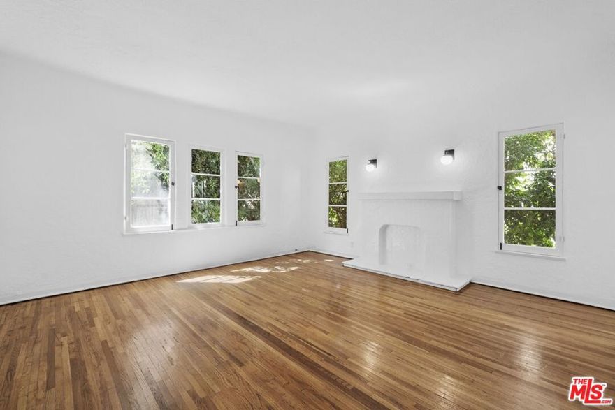 Spacious and upgraded Two-Bedroom/One Bathroom top floor corner unit with original 1920's architectural details. Property is in one of the trendiest parts of the Westside where Beverly Hills, West Hollywood, and Beverly Grove meet. This home is one block south of Beverly Blvd, four blocks south of Melrose, and a very short distance to both Santa Monica Blvd and Robertson Blvd. All the Westside's trendiest shopping, coffee shops, and fine dining are at your fingertips. Living spaces feature original hardwood flooring, high ceilings, lots of natural light, a decorative fireplace, and original 1920s details. The kitchen is large and features a subway style backsplash and countertop, a brand-new fridge, stove/oven, tons of cabinet storage, and space for a breakfast nook. The bathroom features a spacious soaking tub/shower with subway tile shower walls, a pedestal sink, and patterned tile flooring. The bedrooms are spacious, have lots of closet room, and high ceilings. Only a 5-Minute drive to West Hollywood, Beverly Hills, Century City, and Beverly Grove. Street parking and no on-site laundry. Enjoy a luxury living experience in a classic 1920's building in one of the most in demand locations on the Westside.