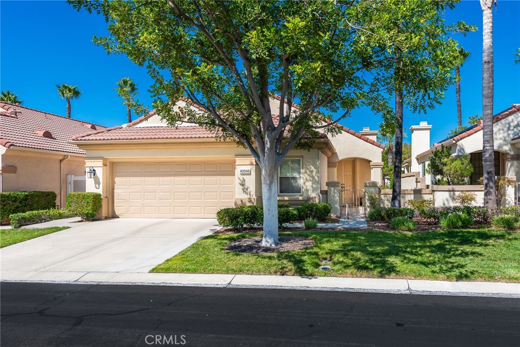 Welcome to this stunning single-story home, perfectly nestled in a beautiful, established neighborhood "The Colony" Boasting a fantastic blend of comfortable indoor living and sun-drenched outdoor enjoyment, this property is ideal for those seeking modern convenience in a serene setting. Step inside to an open floor plan where the main living areas flow seamlessly. The heart of the home is the updated kitchen, featuring, extensive white cabinetry for incredible storage, sleek stainless-steel appliances, quartz countertops, a modern backsplash, and a large center island with seating. Relax in the main living room beside a cozy fireplace, or unwind in the adjacent carpeted den, perfect for movie nights. High ceilings and ceiling fans enhance the bright, airy atmosphere throughout. The spacious Primary Suite is a true retreat, offering plush carpeting, an en-suite bath, and direct sliding door access to the private outdoor space. Outside, you'll find a large, shaded pergola-covered patio an ideal setting for al fresco dining, entertaining guests, or simply enjoying the California sunshine. Other features include new blinds in the bedrooms, updated bathrooms with new sinks, counter tops, and modern light fixtures shutters in living and family room, low maintenance landscape with newer sprinklers.