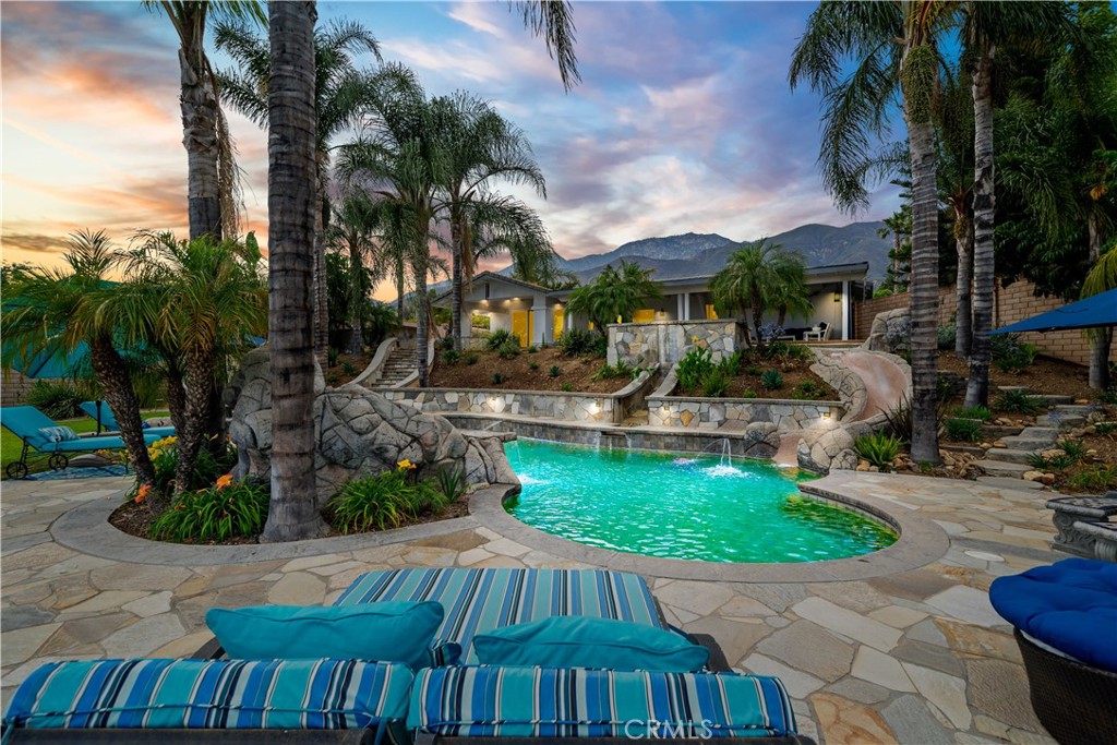 ***Welcome to Paradise*** Don't miss out on this incredible opportunity to own this gorgeous single story salt water POOL/SPA home with VIEWS,VIEWS,VIEWS in a highly desirable location!! Situated on a great sized half acre corner lot and also on a cul-de-sac, this home is amazing for entertaining and more!! As you approach the residence, enjoy the attached 3 car garage, tranquil fountain near the entry way, and mature landscaping. Also enjoy the tasteful exterior and interior paint schemes. Upon entry, enjoy the living room, extra dining space, beautiful exposed wood ceilings with recessed lighting, gorgeous open kitchen with plenty of cabinet and counter space as well as a dishwasher, trash compactor, range, built in microwave, the list goes on!! The family room features a warm and inviting fireplace, nice vaulted ceilings, ceiling fan, large sliding glass door that showcases the views, and a bar area. The master bedroom also features a private sliding glass door and access to the patio area, as well as a gorgeous en suite master bathroom with custom cabinets and shower. Other notable features include the custom outdoor cook station with bar, sink, natural gas BBQ, refrigerator and storage, gas fire ring, tile roof, Tesla 230 volt charger with dedicated circuit, custom wrought iron pergola, whole house fan, pool safety fence included, close to bridle trails, so many things!! The back yard is AMAZING!! Enjoy entertaining with the covered patio, large raised spa, amazing pool with slide and waterfall, rear access for vehicles, RV, toys and more, garden area, built in BBQ area, and breathtaking views, you have to see in person!! Located close to freeways, shopping and entertainments, parks, desirable schools, and SO MUCH MORE!! Act now, before it's too late!!