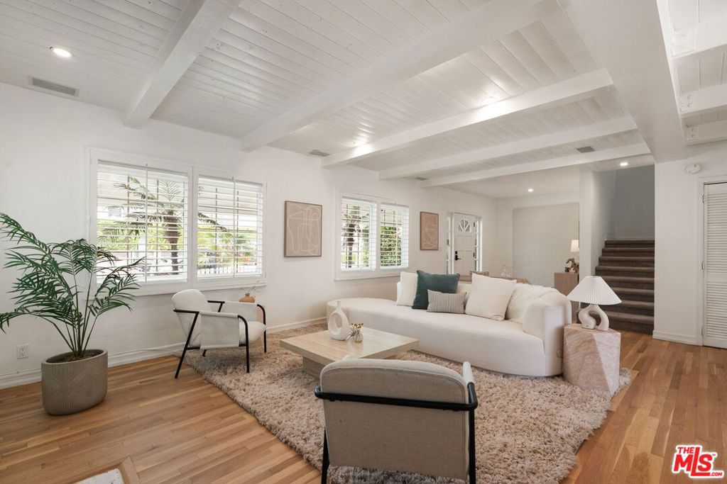 Experience the perfect blend of modern living and coastal charm just three blocks from iconic Venice Beach. This updated property offers versatility with a spacious 4-bedroom, 3.5-bathroom main home and a thoughtfully renovated 1-bedroom, 1-bathroom ADU, ideal for extended family, guests, or rental income. The main home features an open, light-filled layout with a natural flow between the living, dining, and kitchen areas--designed for both everyday comfort and easy entertaining. The kitchen boasts contemporary cabinetry, ample counter space, and smart appliances that balance style and function. Two primary suites, one on each level, provide private retreats with en-suite bathrooms, while two additional bedrooms share a convenient Jack-and-Jill bath. Multiple outdoor spaces further expand the home's living areas, creating inviting spots to relax or gather. The detached ADU, completed in 2022, enhances the property's appeal with polished concrete floors, in-unit laundry, sleek modern finishes, and large folding patio doors that open to a private outdoor area--perfect for dining, lounging, or enjoying the hot tub. Located in the heart of Venice, you're moments from local shops, restaurants, and the beach, making it easy to enjoy the best of this vibrant coastal community. This is a rare opportunity to own a flexible and well-appointed property in one of Los Angeles' most desirable neighborhoods.