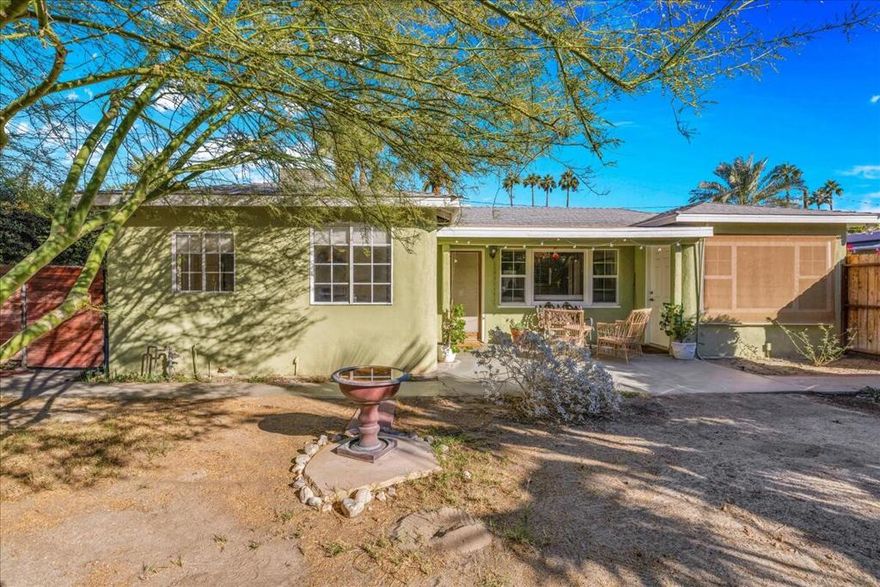 Looking for that perfect Movie Colony East spot close to everything downtown? Well, this charming 3-bed, 2-bath cottage might be exactly what you've been searching for. What really stands out is the versatility. The third bedroom has its own entrance, so you've got options whether you want a private guest suite or an office space that keeps work separate from home life. Both the front and back yards give you plenty of room to add a pool or spa down the line, which is rare to find at this price point in this neighborhood. The location is honestly hard to beat. You're literally minutes from Ruth Hardy Park for morning walks and close enough to downtown Palm Springs that you can grab coffee or dinner without having to drive. It's quiet here, but you're not sacrificing convenience. Inside, you'll find tile floors throughout (great for our desert climate), beautiful vaulted wood ceilings that give the space an airy feel, and crown moldings that add character. The windows have been updated, there's a garage for storage, and you've got both central AC and an evaporative cooling system to keep things comfortable year-round without breaking the bank on utilities. Showings require 24 hours notice. Just let me know when works for your schedule.
