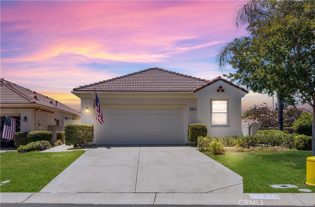 Welcome to 23681 Corte Sabio, a beautifully maintained home nestled on a generous 6,972 sq ft corner lot in the heart of The Colony — one of Murrieta’s most desirable 55+ guard-gated communities. Walk in through a double-door entry and you are greeted by high ceilings and tons of natural lighting. At the entry, a cozy den offers the perfect space to unwind, read, or entertain guests. To the left, a short hallway leads to the indoor laundry room and convenient access to the two-car garage. This wing of the home also features a full guest bathroom and a spacious bedroom—ideal for visiting family or as a flexible office or craft room. The remodeled kitchen features updated white shaker cabinets, sleek quartz countertops, and abundant pantry space. The open-concept layout offers a seamless flow into a dining area and sizable living room. The primary suite is tucked privately toward the back of the home and features direct access to the backyard along and also features an upgraded en-suite bathroom with dual sinks, complete with a walk-in jetted safety tub. Outside, the backyard strikes a wonderful balance between low-maintenance comfort and outdoor enjoyment, with a pergola-covered patio space and a great grass area. Located in The Colony, you will have access to a vibrant, amenity-rich lifestyle. Residents enjoy a resort-style clubhouse with a fitness center, pool, spa, lighted tennis and pickleball courts, library, billiards room, hair salon, and offers 24/7 guard-gated security. There’s also an 18-hole golf course that winds through the community, along with a wide range of social clubs and activities that make it easy to connect with neighbors.