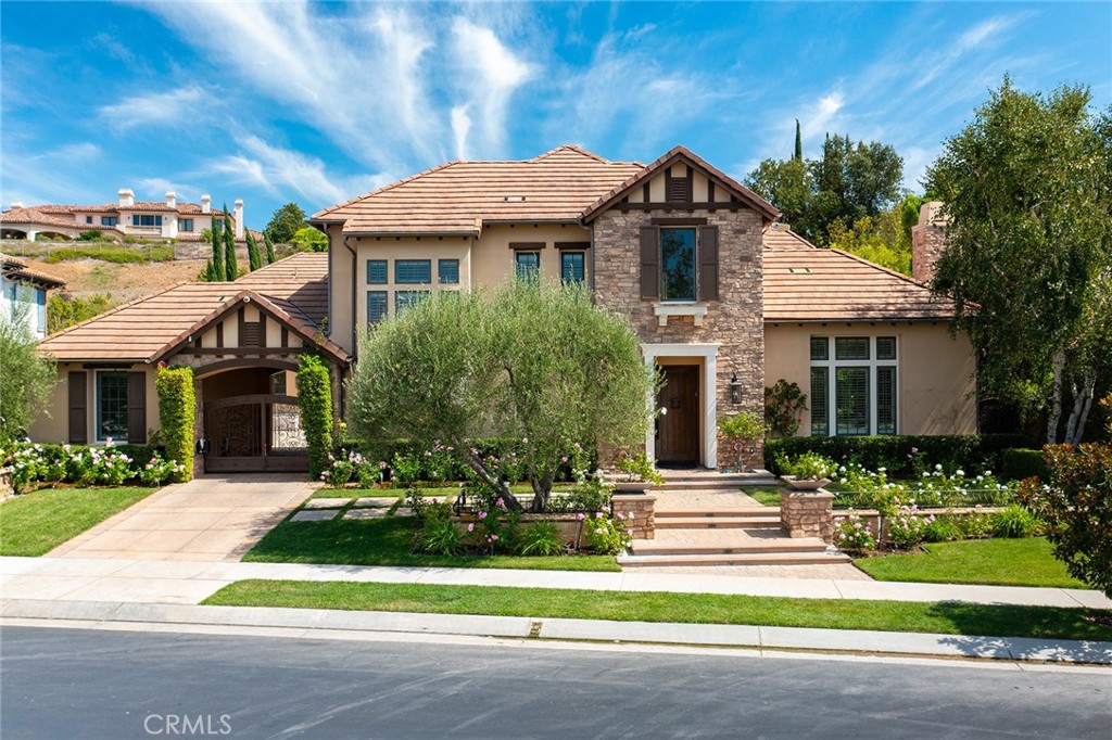 Situated on an upper cul-de-sac street—the final enclave before the exclusive 2nd gate to The Estates—this remarkable residence combines privacy, prestige, and the lowest price per square foot in the Oaks of Calabasas community. A privately gated driveway leads to a 5-bedroom residence including a detached casita suite and multiple versatile bonus spaces designed for modern living. Additionally, this estate features a bedroom-to-gym conversion, complete with elevator, easily adaptable back to a bedroom if desired. All bedrooms are en suite for comfort and privacy. The chef’s kitchen opens seamlessly to the family room, creating the perfect hub for entertaining and everyday living. There is also a teen/movie room off of the courtyard for recreation and relaxation. The lushly landscaped grounds feature a resort-style pool & spa with water features and two fire bowls, a covered patio with interlocking stone decking, outdoor barbecue center, lawns, rose gardens, and mature trees. Additional gated parking behind its own electric gate adds convenience and security. Living in The Oaks of Calabasas means enjoying a prestigious guard-gated community with access to exclusive amenities, unparalleled security, and proximity to Calabasas’ premier shopping, dining, and award-winning schools. This is more than a home—it’s an unmatched value in one of Southern California’s most prestigious neighborhoods. Come check it out!