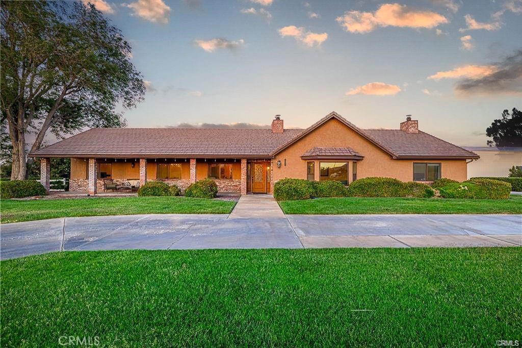 **STUNNING PRIVATE POOL HOME WITH A GUEST HOUSE IN WEST PALMDALE** Fabulous custom home on 2.5 Acres! Automatic gates and circular driveway with beautiful landscaping. Inside you will find open sprawling floor plan with high ceilings, formal living/dining room or large den area (both with fireplaces). Remodeled kitchen with granite counters, farm sink, lovely cabinets & stainless steel appliances. Down the hall the primary bedroom (with fireplace) has an en-suite beautiful bathroom with separate jacuzzi tub & shower. In addition, one of the secondary bedrooms also has an en-suite bathroom (great for guests). Need a home office or area for home schooling? This home boasts a massive office area/home school area, so don't look any further. Outdoor you find a 2000 Sq Ft Metal shop with large roll-up door along with 30 & 50 Amp breakers, 1650 SQFT of newly built shop (perfect for your RV). In additional to the square footage shown, there is a 350 Sq Ft Pool house with bedroom, full bath & kitchenette. A few of the additional items this house has to offer: 3 Air conditioners, New windows, 2 Evap coolers, Whole house fan, Security Camera