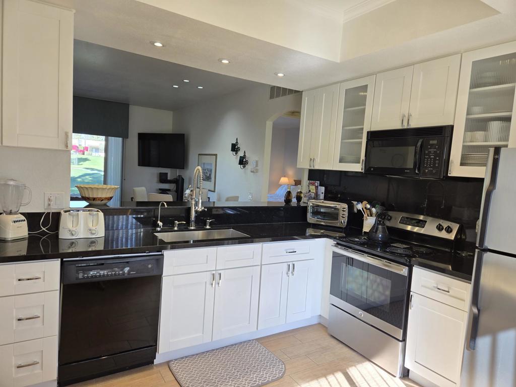 REDUCED! Welcome to your stunning new home in the heart of Desert Princess located on the Logos 5 green! This beautiful remodeled 2 ensuite condo is designed for those who crave luxury and comfort. Imagine sipping your morning coffee while soaking in the breathtaking views from both the front and back patios. With all tile flooring and a remodeled kitchen, built in wine fridge, you'll feel right at home as you whip up gourmet meals in style. The striking remodeled bathrooms and nice furnishings add the perfect touch of elegance to your living space. HVAC is 3 years old and is a 3.5 ton. Hot water tank is 3 months old. Plus, being located just across from the Arroyo's homes, you'll have easy access to the sparkling pool and scenic walking path, making it perfect for an active and serene lifestyle. And let's not forget the convenience of a single car detached garage! Don't miss out on this incredible opportunity to live in a community that embraces comfort and luxury!Land lease thru 2044, Monthly Ground Rent is $186.54.The Desert Princess has an affordable 27-hole PGA Championship golf course, no Tee-time lotteries, no initiation fees, rated among the best in the valley by GOLF DIGEST. Bocce Ball, tennis and pickleball, we have it all! This quiet community is away from the noise yet minutes from everything that is in Palm Springs; restaurants, shopping, casinos, an international airport, the Tramway, Art Museum, Theaters, and the Street Fair.