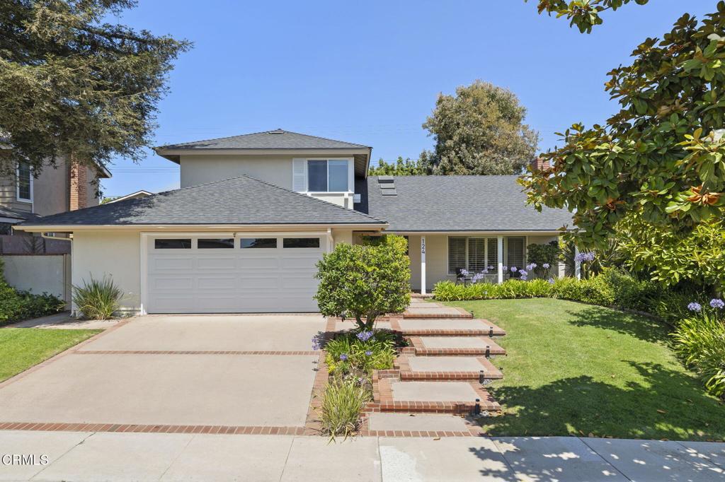 Located on a quiet cul-de-sac north of Las Posas, this 4/2.5 home is ready for the next family to make it their own. The lot abounds with greenery including a majestic redwood - just perfect for afternoon shade. Complete with keyless entry and a beckoning front porch, you feel like you stepped back in time with all the modern conveniences.The entry leads to a vaulted ceiling living room with dramatic rock fireplace. step to the left and you have a spacious dining room with access to the private patio area and a bubbling fountain to create a place to unwind after a long day. The kitchen has been remodeled and features upgraded stainless steel appliances, including a 2 drawer dishwasher. Pull-outs and organizers compliment the efficiency. The app controlled lighting gives you lots opportunities to create a special ambiance.The amazing 600 sq. foot family room is open to the kitchen area and will definitely be the family gathering spot for all occasions .The wall of elegant built-ins gives everyone a spot to store and display their precious and fun items. The corner fireplace gives those chilly nights a boost of warmth and creates a nice focal point for the room. With French doors, numerous windows and skylights to allow ventilation, this room is both bright and perfect for entertaining. The primary suite is located on a step up level all its own, giving privacy yet steps away from the 3 additional bedrooms and bath. The answer to those who want to be closer to the children...but not that close! Whether you are searching for the perfect family home, entertaining home or idyllic quiet cul-de-sac close to amenities but feels like you are miles away- 124 Reddington checks all the boxes.Call for your private showing and be prepared to call it yours!