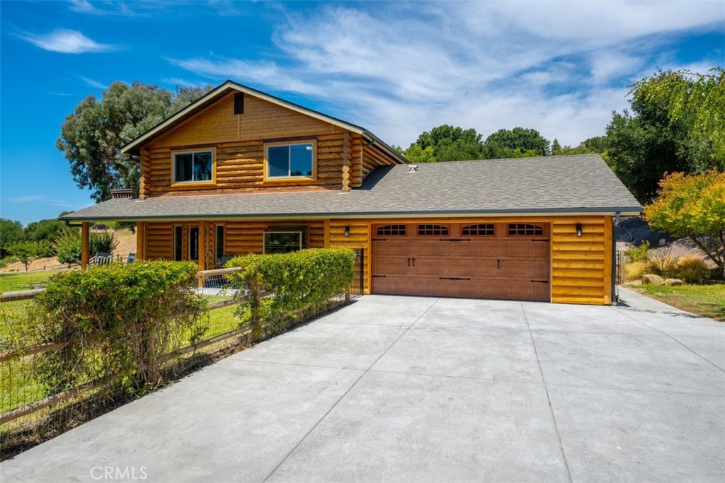 Nestled in the prestigious Corbett Highlands area of Corbett Canyon, this breathtaking 4-bedroom, 3-bathroom estate sits on nearly 5 acres of serene, picturesque land, offering the perfect balance of luxury living and Yellowstone ranch-inspired charm. Crafted with imported Canadian cedar logs, the exterior radiates the timeless beauty of a western ranch while seamlessly integrating modern amenities. One bedroom and bathroom are located on the entry level, while the other three bedrooms and two bathrooms are situated on the second level. The kitchen and upstairs bathrooms have been recently updated.
Whether you are a horse owner or a car enthusiast, this property is a dream come true with its expansive barn, large paddock, and ample space for stalls, offices, or vehicle storage and maintenance. Enjoy the tranquility of your private orchard, lush pastures, and the convenience of being equidistant between the charming village of Arroyo Grande and the vibrant downtown San Luis Obispo. This home is located on one of the most sought-after streets in the popular Corbett Canyon corridor. It has two separate driveway entrances, connected; one provides easy access to the house, and the other to the ranch facilities. You’ll appreciate both the privacy and functionality this exceptional home offers. Just down the road from Edna Valley wine country.
This is more than just a home; it’s an exclusive lifestyle waiting to be enjoyed. Possible site for an ADU.
